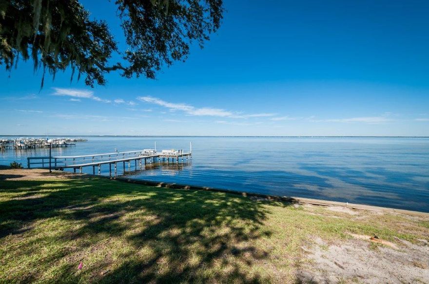Enjoy a beautiful bay view from the private patio and screened-in porch at this lovely townhome. The kitchen has been upgraded with cabinets and an island that provides ample storage. The spacious, second floor master bedroom has been updated with additional windows to enhance the view from the room and its adjacent office space. The current owner converted one of the spare bedrooms into a sitting room, also located directly off the master. Enjoy all the amenities of this serene complex, including a community dock, swimming pool boat ramp and tennis courts. Buyer to verify all date, dimensions and specifications important to them. Low HOA.