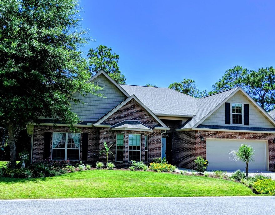 Wow!! Best deal in quiet Peach Creek subdivision. This home feels like a custom home, only without the custom price tag. Beautiful landscaping outside, character and upgrades inside. The great room has soaring cathedral ceilings, triple windows that overlook the treed private backyard. The beautiful kitchen has an island, oversized pantry and stainless range hood that makes cooking a joy. Spacious bedrooms, tile and laminate wood floors throughout make beach life easy. The relaxing owner's retreat has a wood inlayed tray ceiling and spacious, sunny bath with dual sinks and walk in closet. The character continues upstairs to the bonus room with a brick accent wall and built in shelves. This is a great space for a 4th bedroom, home office or game room.