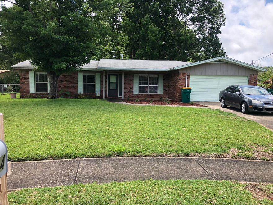 Large 3 bedroom, 2 bathroom brick house located on a large lot in a cul de sac. The home has new tile through out, its been recently painted. There have been upgrades in the bathrooms including new tile surrounds. There are two separate living areas. The backyard is huge with big trees for shade. This home is a must see! Call today to view your new home!