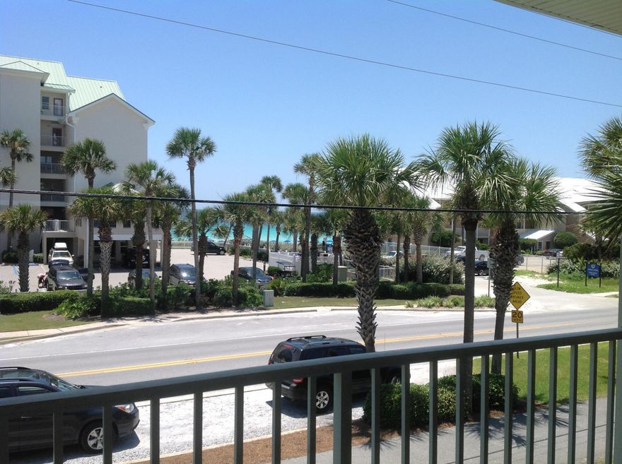 Location! Crystal Beach and Across from the Beach with Gulf Views! Rarely does a 2 bedroom unit in the Gulf Facing buildings come available in Caribbean Dunes! There are only 4 - 2 bedroom units in building 1. Caribbean Dunes is a 2story low rise condo complex featuring a Large Pool, Hot Tub, BBQ Grills and Community Room. Unit 205 is a 2nd floor unit with a master downstairs and a Loft style 2nd bedroom with full bath. The living room features a vaulted ceiling and French doors opening to a spacious tiled balcony with excellent gulf views. A large kitchen with an abundance of cabinets opening into the living and dining making the entire area light and cheerful. The kitchen, living room and bathrooms are tiled with carpet in the bedrooms. There is also a stack washer and dryer for your