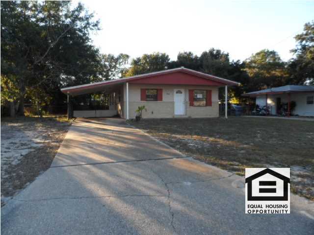 Solid, ranch home offers a huge, fully fenced backyard for room to run, entertain, and the beloved pets! Interior features a formal living room w/wood laminate flooring, pretty kitchen w/upgraded cabinets and all appliances, spacious laundry room, cozy bedrooms that just need fresh paint and flooring, and an upgraded bathroom. Minor cosmetic work here and you'll have a fine home. Located just east of Memorial Pkwy, you have excellent proximity to Max Bruner Middle, Miracle Strip Pkwy, and Santa Rosa Island and it's beautiful beaches!