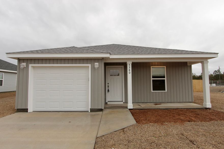 When you step inside, you'll be greeted by the sleek elegance of luxury vinyl plank (LVP) flooring, seamlessly flowing throughout the entire home. The heart of the home is the stunning kitchen, adorned with quartz countertops and complemented by a beautiful tile backsplash. Picture yourself preparing meals with ease on the spacious island, with the added convenience of an under mount sink and stainless steel appliances. The open floor plan creates a welcoming atmosphere, perfect for enjoying day-to-day living. Natural light floods the space, highlighting every detail of this thoughtfully designed home. Rest easy knowing that the home has blinds offering privacy and style with a simple touch. The garage isn't forgotten either with epoxy floors adding durability and a touch of