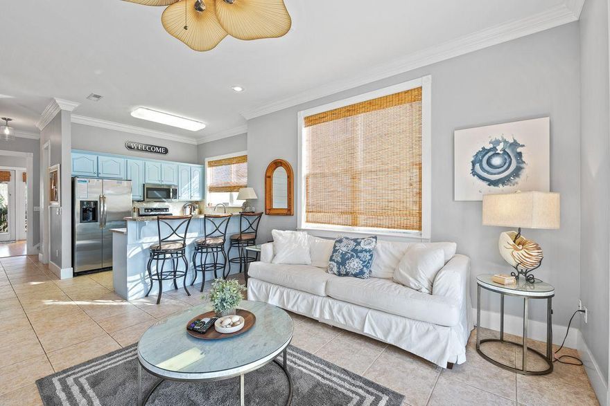 Located in the gated La Valencia Beach Resort community, this wonderful vacation retreat offers a spacious floor plan and deeded beach access. Well-maintained and move-in ready, interior living spaces are open and serene with high ceilings, a neutral color palette, and tile flooring. Natural light flows seamlessly through oversized windows. The fully-equipped kitchen features stainless steel appliances, granite countertops, and a breakfast bar, while a separate dining area includes a shiplap accent wall. The back door leads to a spacious covered deck for outdoor dining and entertaining.This three-bedroom townhome offers comfortable accommodations with one suite located on the first floor and a master suite and additional guest room upstairs.