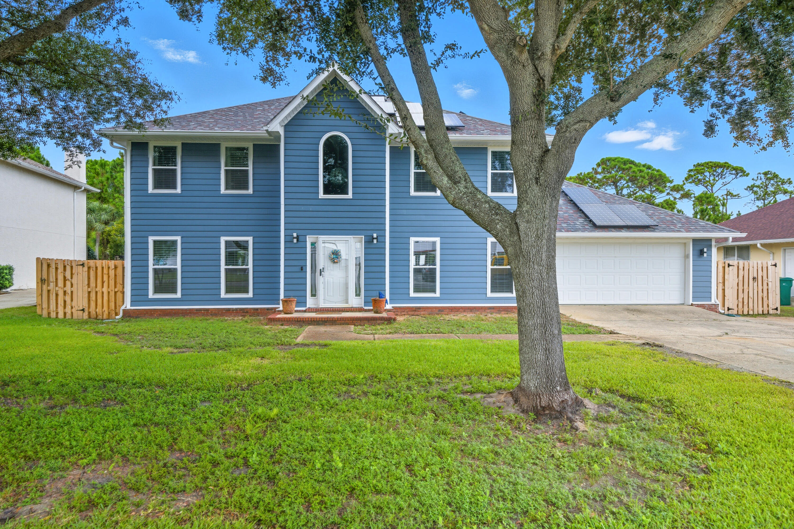 Welcome to 159 Shore Line Drive, a beautifully renovated coastal retreat in Mary Esther offering modern luxury, energy efficiency, and a prime location with sound views. This home has been completely transformed with upgrades that combine style, comfort, and durability. Inside, you'll find brand-new impact windows with warranty and custom blinds, including an electric foyer blind with remote. The reimagined kitchen showcases custom soft-close cabinetry with pull-outs, all new appliances, and a thoughtful reconfiguration for today's lifestyle. The home also features new PEX plumbing throughout, a new gas line servicing the stove, dryer, and water heater, and a tankless water heater with on-demand heat and a recirculating pump. Every detail has been modernized, from the sleek LVP flooring and fresh paint with smooth Level 5 ceilings to LED lighting, ceiling fans, and a full electrical upgrade with contemporary switches and outlets. The bathrooms have been remodeled with new vanities, mirrors, toilets, faucets, and shower heads. Custom closets have been added to all bedrooms and hallways, while a stunning new wood staircase with iron railings adds architectural charm. Additional updates include all new doors, hardware, hinges, modern coastal baseboards, fresh A/C vents, and new smoke detectors.
On the exterior, the home boasts new impact siding, Zipboard, gutters, and a refreshed paint finish. A new fence with gates, keyless entry locks, and a remote garage keypad add both security and convenience. The yard has been leveled, old trees cleared for improved curb appeal, and a brand-new irrigation pump with repaired sprinkler heads ensures a lush landscape. The new mailbox, paid-off solar system, and top-of-the-line A/C units that have just been serviced provide added peace of mind, along with a 3-4-year-old roof.
THIS HOME HAS NEIGHBORHOOD BEACH ACCESS with membership of VOLUNTARY HOA!