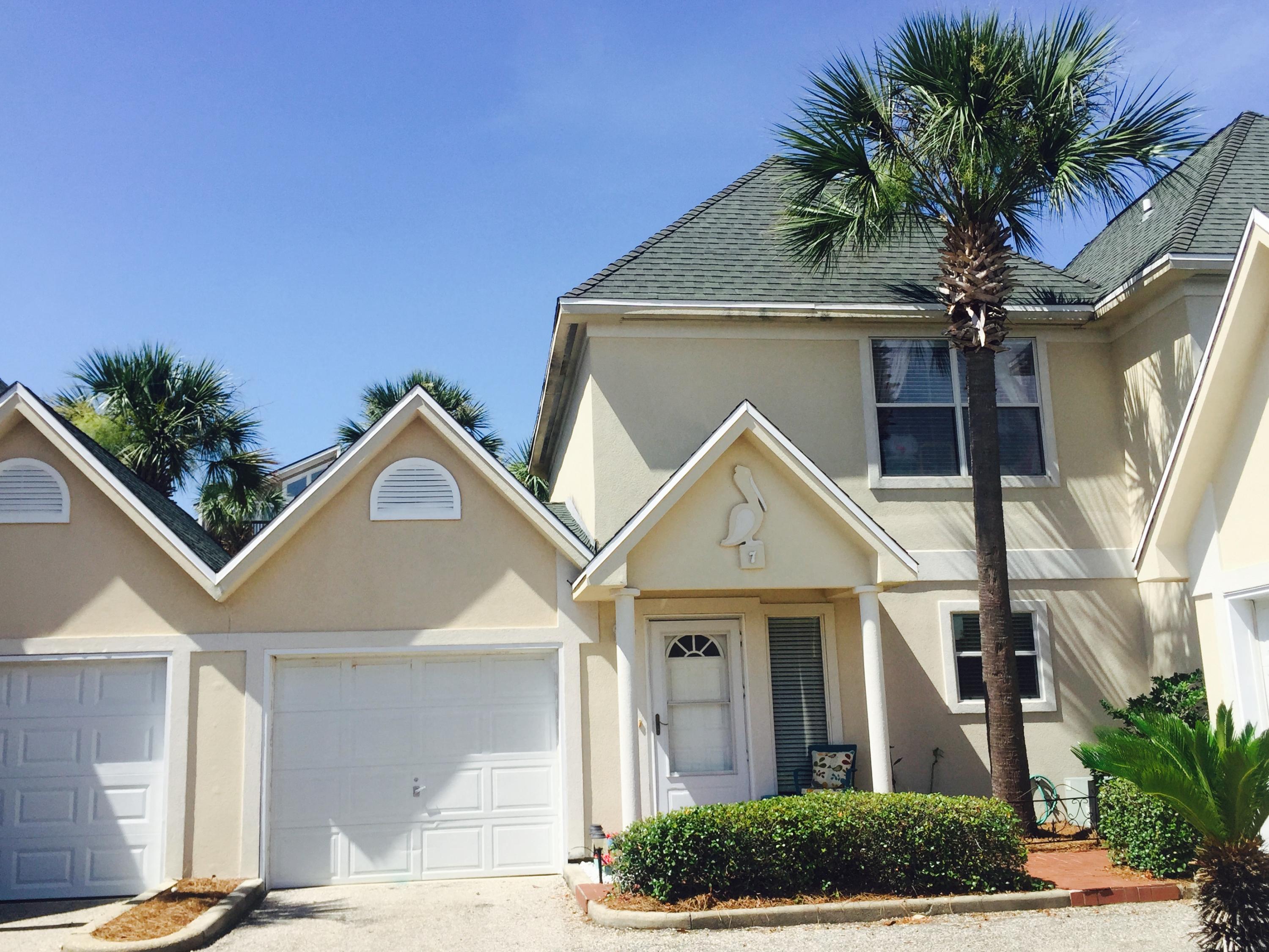 Beautiful and perfectly located town home walking distance to the Destin harbor! The unit has had pride of ownership and it shows. Some of it's features include wood laminate floors on the first floor, very open and spacious living room, tile kitchen counter tops, cathedral ceiling in the master bedroom, large walk-in closet, and more. Pelican Place Townhomes features a community pool and is conveniently located to the Destin harbor so it is just a short walk to all of the restaurants and fun that the area is known for. Buyer is to please verify all information, including square footage and room dimensions.