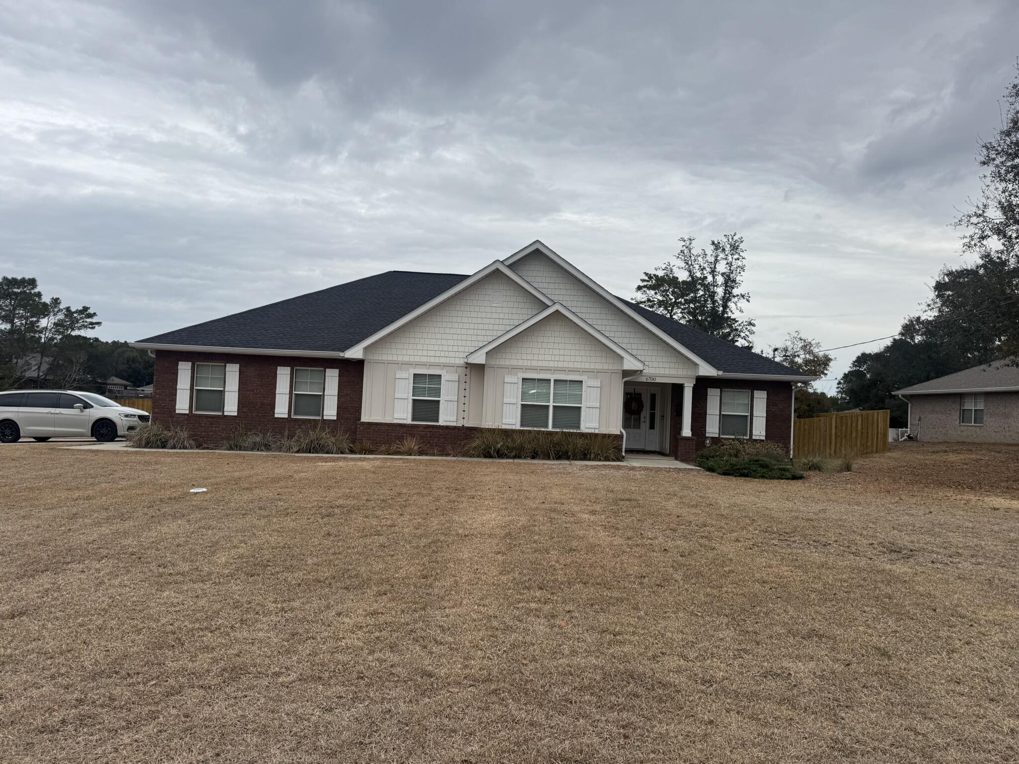 Welcome to your coastal paradise in Navarre, minutes from the beach. This 4 Bedroom, 2 full bath home features a huge kitchen with KitchenAid stainless appliances and recessed lighting opening into a large living room with vaulted ceiling. Primary bedroom features trey ceiling, with recessed lighting. Primary bathroom features separate walk-in shower, garden tub, 2 large walk-in closets, and double vanities. LVP flooring throughout the home, with porcelain tile in the bathrooms and laundry room. Spacious entertainment space abounds in this home, with a covered back patio perfect for firing up the grill. This magnificent home is located on a corner lot in Holley By the Sea. Amenities in this sought after community include pool, locker room, fishing pier, tennis courts, gym, sauna/steam.... Welcome to your coastal paradise in Navarre, minutes from the beach. This 4 Bedroom, 2 full bath home features a huge kitchen with KitchenAid stainless appliances and recessed lighting opening into a large living room with vaulted ceiling. Primary bedroom features trey ceiling, with recessed lighting. Primary bathroom features separate walk-in shower, garden tub, 2 large walk-in closets, and double vanities. LVP flooring throughout the home, with porcelain tile in the bathrooms and laundry room. Spacious entertainment space abounds in this home, with a covered back patio perfect for firing up the grill. This magnificent home is located on a corner lot in Holley By the Sea. Amenities in this sought after community include pool, locker room, fishing pier, tennis courts, gym, sauna/steam room, and much more.