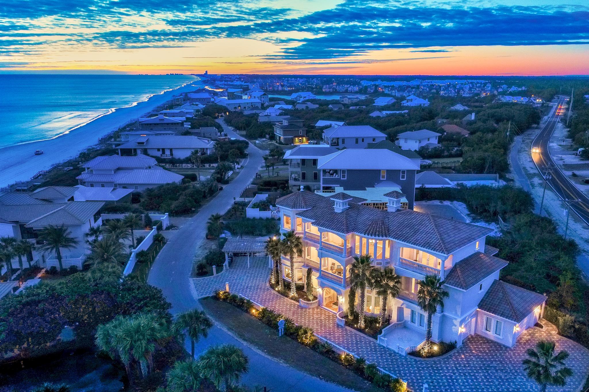 South of Scenic Highway 30A in the gated community of Pelican Circle, this luxurious old world style Mediterrean villa is a work of art with its large stone paved driveway, travertine and marble flooring, spiral stone staircase, marble stairs, onyx baths, ornate crown molding, custom-made iron doors and sound-proof theatre style media room. This spacious home boasts over 5,500 square feet, 6 bedrooms, 4 full + 3 half baths, and a private saltwater pool with grotto and slide.