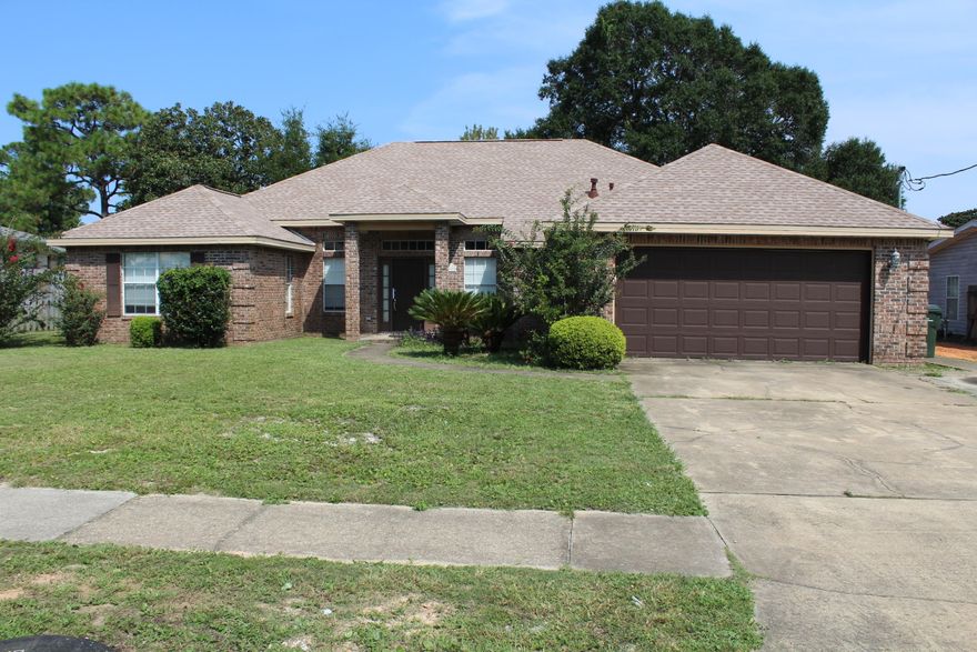 Newer home centrally located in Fort Walton Beach! This home features an open floor plan and high ceilings giving it a very bright and airy feeling. The Kitchen looks out over the family and dining areas. The master bedroom is large and has enough room for a morning retreat. The master bath is also quite large and features double vanities, soaking tub, and stand-up shower. The additional bedrooms are both very large on the opposite end of the home. Out back you will notice the 8x33 covered porch that looks out over the back yard and the open patio with built-in brick grill. Here you are within walking distance to several shopping complexes to include Publix, TJ Maxx, and Home Depot. Call today for your private showing before this one is gone!