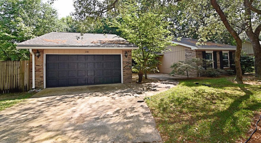 This 3BR 2BR home is in a highly coveted neighborhood of Bluewater Bay, situated on a large .31 acre lot complete with privacy fence.The kitchen features ceramic tile, matching whirlpool stainless steel appliances, and white cabinets. The wood floor and vaulted ceilings make the open living space and formal dining room feel even larger, complete with an updated fireplace.The spacious master bedroom includes an updated double vanity and shower/tub, as well as a large walk-in closet. Both additional bedrooms are spacious with a shared bathroom that is also updated.The enclosed screened porch leads to an open backyard patio area. The 2 car garage, ample driveway space, and large front yard compliment the serene neighborhood very nicely. This home won't last long!