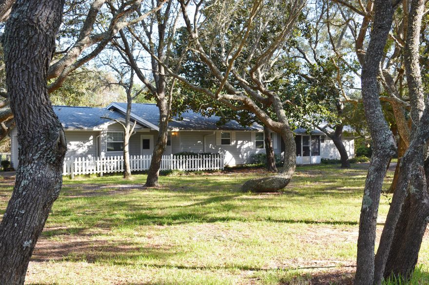 NEW PRICE!!!This quaint Florida Cottage is situated on a HUGE CORNER LOT located in the HEART OF DESTIN, FLORIDA surrounded by beautiful Oak Trees. The property is close to the Sugar White Sands and Crystalline Green Waters of the Emerald Coast. The home features a Kitchen, Breakfast Nook, Large Great Room with a Stone Fireplace and the Master Bedroom has a large closet. The property is located near Shopping, Dining, and other amenities that the area has to offer. For the Fisherman, the Destin Harbor has many Charter Boat options. For the Boating Enthusiast, Joe's Bayou Public Boat Launch ensures everyone the opportunity to enjoy the boating lifestyle. For the Golfer, there are many beautiful Courses in the area. This property is a must to see!! Buyer to verify all lot and home dimensions.
