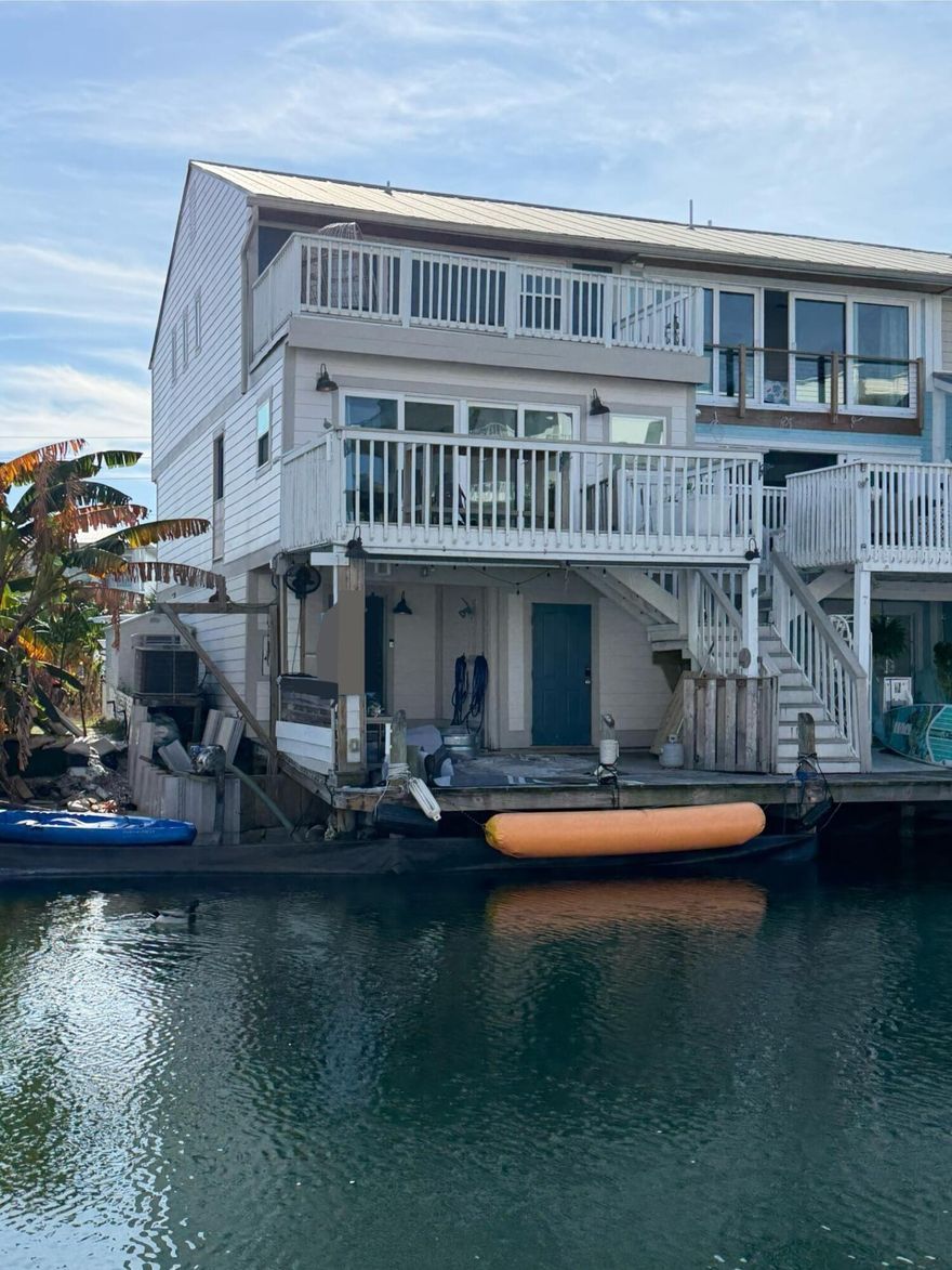 Coming Soon - End unit, waterfront townhome with a boat dock.