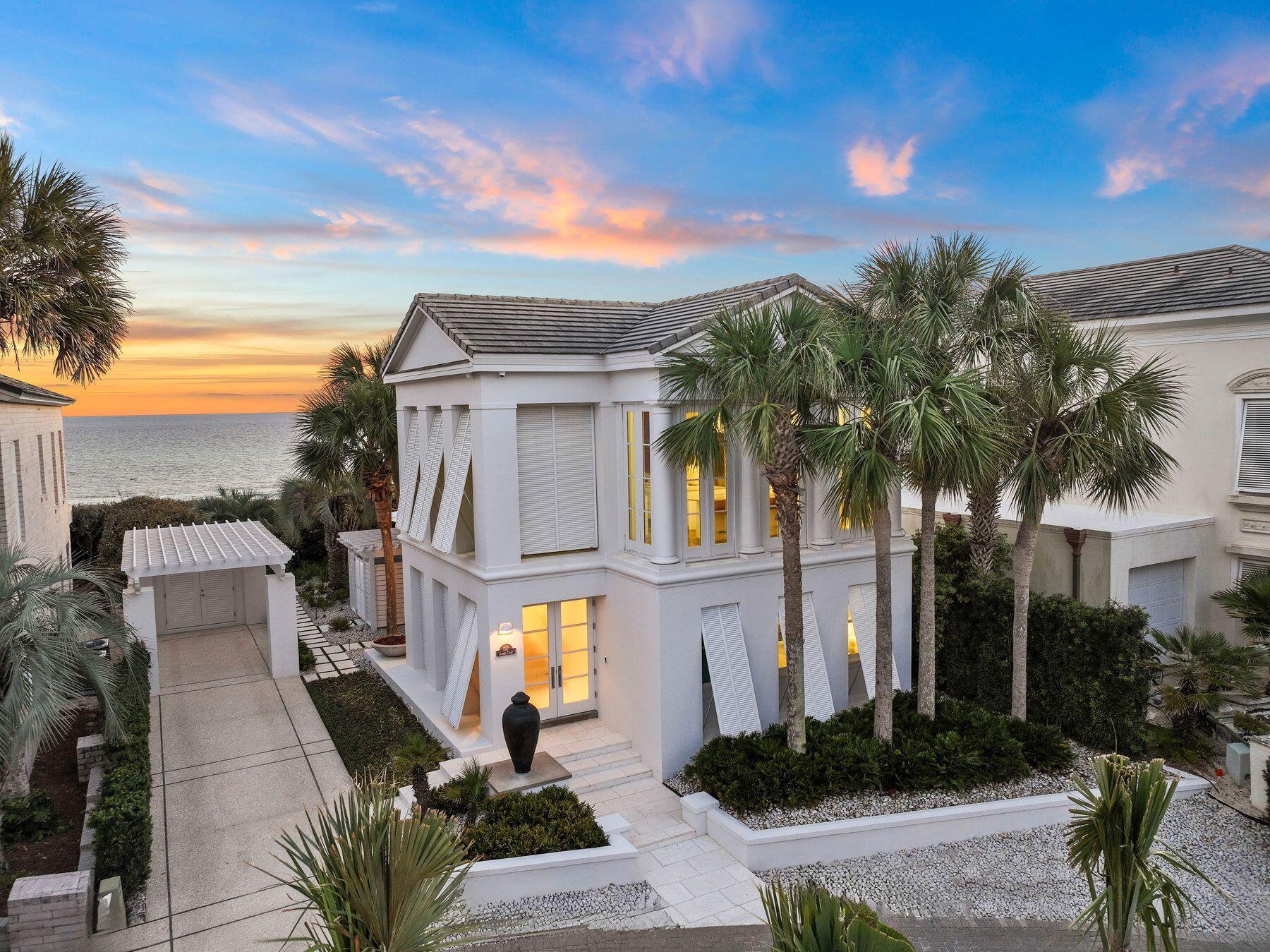 Immerse yourself in the distinctive combination of 30A lifestyle and Mediterranean-inspired design with this exceptional residence. Nestled within a secure boutique community, this immaculate home boasts unobstructed gulf views complemented by charming shuttered windows. The discerning eye will be drawn to the expansive windows, Carrara marble floors, and the impressive 12 to 14-foot ceilings which create a peaceful atmosphere illuminated by abundant natural light. The home's open-concept living and dining areas are designed to provide panoramic vistas of the sparkling Gulf of Mexico, ensuring every moment at home is accompanied by breathtaking views. Even the office nook offers inspiring scenery,