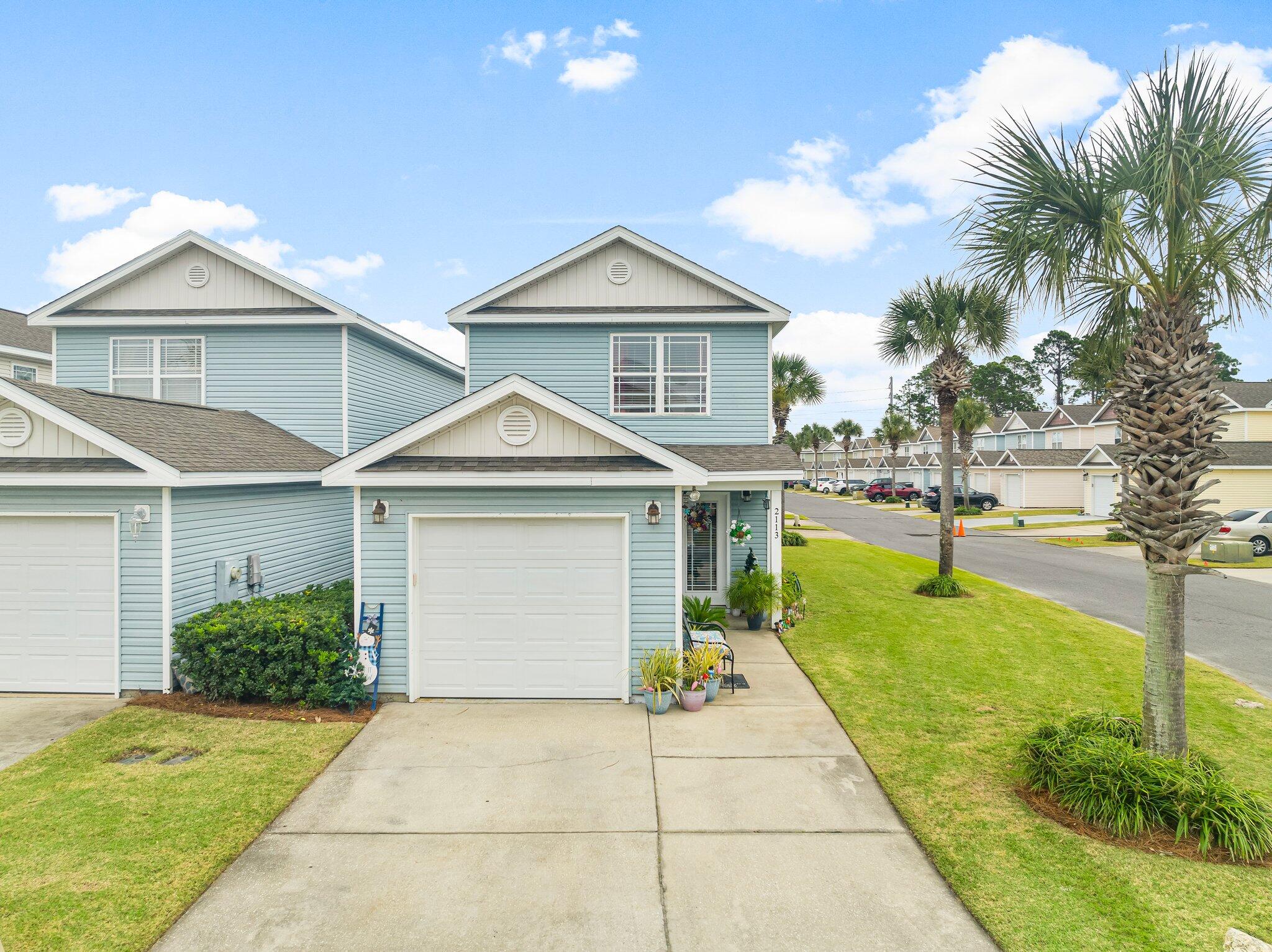 Welcome to this beautifully updated 2-bedroom, 1.5-bathroom town home in the desirable gated community of 'Gates at Sterling Cove.' Nestled on a corner lot in this peaceful neighbourhood, this home offers the perfect blend of modern upgrades and comfort. Step inside to find an updated kitchen featuring sleek quartz countertops, new cabinetry, and ample storage space, complemented by high-quality appliances. The open-concept living area boasts new LVP flooring downstairs, creating a stylish and low-maintenance environment. The washer and dryer are conveniently located upstairs, adding to the ease of everyday living.  Ideally located just 2.1 miles from NSA, 7.3 miles from Pier Park, and only minutes from the nearest beach access.