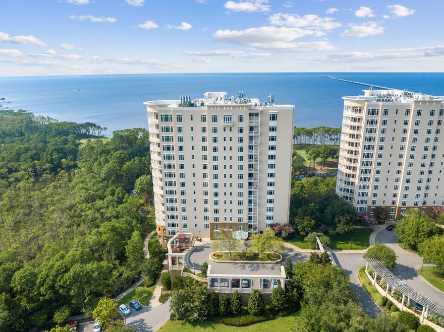 Sweeping bay views from both balconies of this 3 bedroom, highly sought-after residence in Building 3 of One Water Place. Featuring 2649 square feet, the Barclay floor plan boasts gulf and bay views, with an open-concept living area, kitchen, and dining area. Two covered patios invite breezy relaxation overlooking the lush grounds and water. The main patio has a built-in gas grill, beverage refrigerator, and sink. Luxurious interior finishes include hardwood flooring, custom built-in shelving and cabinetry in the living room as well as in the spacious master closet, a soaking tub, tray ceilings, and abundant natural light. This unit includes two parking spots in the covered parking garage, plus a convenient storage closet. One Water Place has many well designed amenities.