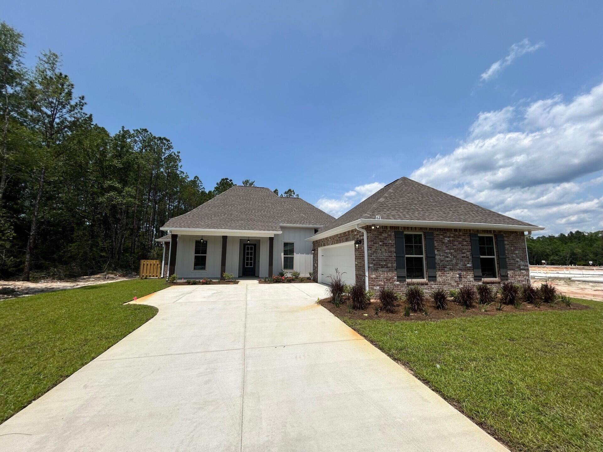 The RENOIR IV I in Bird Song at Hammock Bay community offers a 4 bedroom, 3 full bathroom, open design with flex space. Upgrades added (list attached). Features: double vanity, garden tub, separate custom tiled shower, and walk-in closet in master bath, kitchen island, walk-in pantry, boot bench and drop zone in mudroom, covered patio, crown molding, recessed lighting, smart connect WIFI thermostat, smoke/carbon monoxide detectors, landscaping package, architectural 30-year shingles, flood lights, and more!Energy Efficient Features: water heater, electric kitchen appliance package, vinyl low E windows, and more! Energy Star Partner.