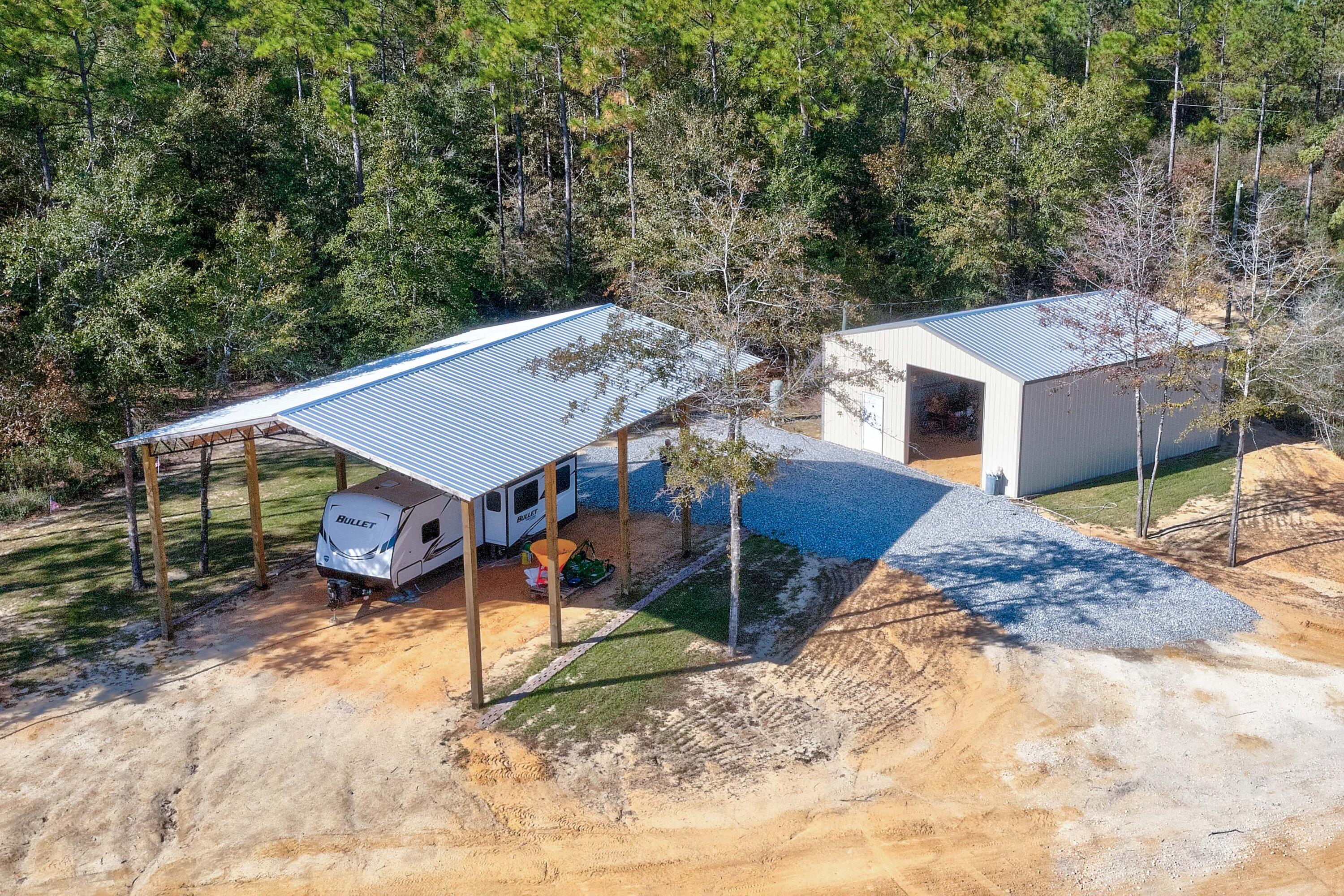 This expansive nearly 40 acre property is located in the heart of Walton Plantation and has plenty of room for all of your favorite outdoor activities. With power, well, and two barns already in place, bring your house plans and build your dream get away! There is a 48x30 open barn, as well as a 36x30 enclosed barn to store your toys and tools while you build. The barns were professionally constructed within the last year. While having plenty of room to play on your own property you'll also enjoy the use of all that the Plantation has to offer. Everything from dirt road riding, fishing, access to the beautiful outdoor chapel, public restrooms and much more!Buyer to verify all information deemed important.