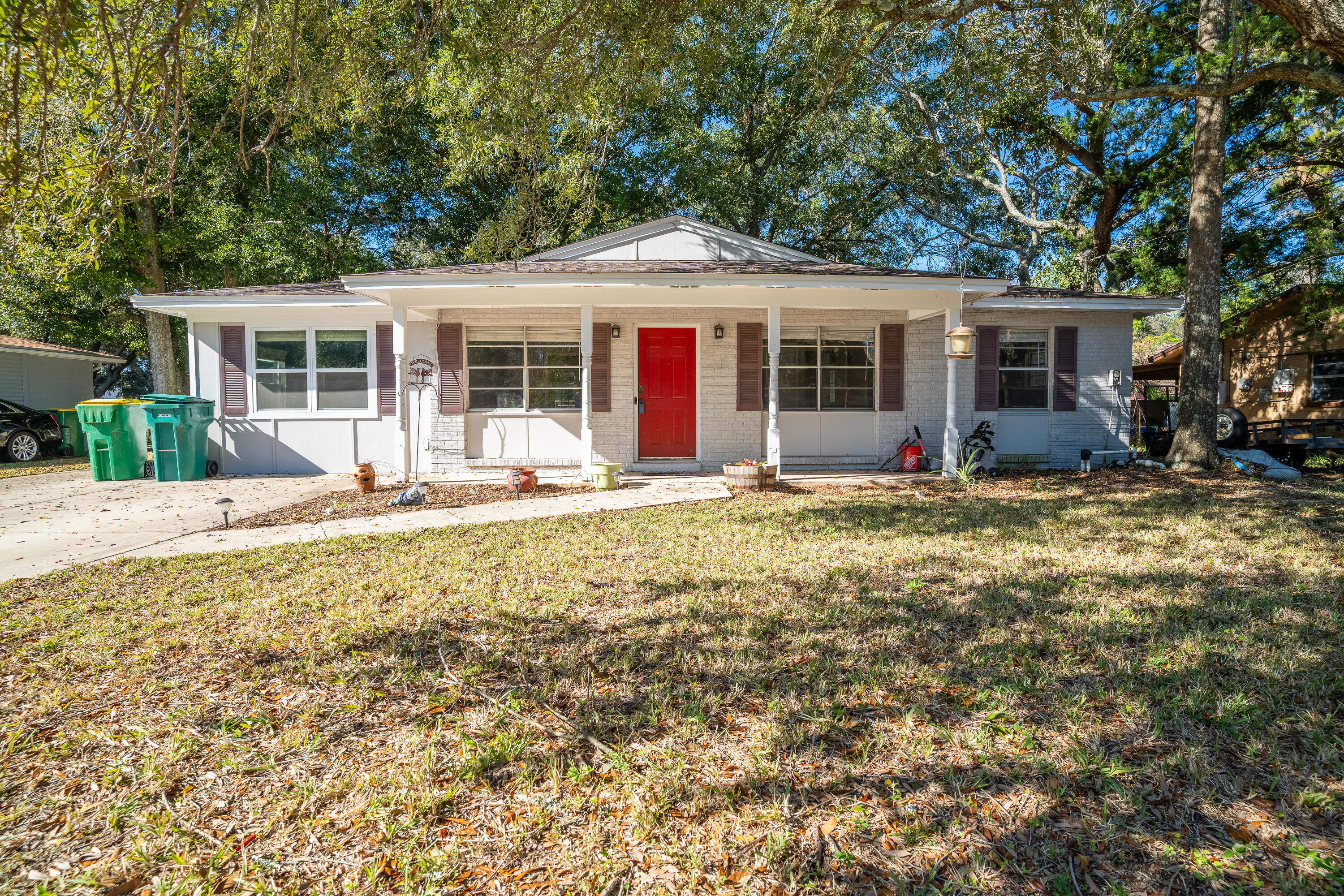 Come home to this lovely mid-century home in the heart of Mary Esther.  Low traffic cul-de-sac. Easy access to all your needs plus the BEACH just blocks away. Remodeled in 2014 granite countertops and stainless appliances.  Double living spaces. So much outdoor living to do from the large deck.  Watch the chickens playing or someone working in the shop while enjoying your favorite beverage!