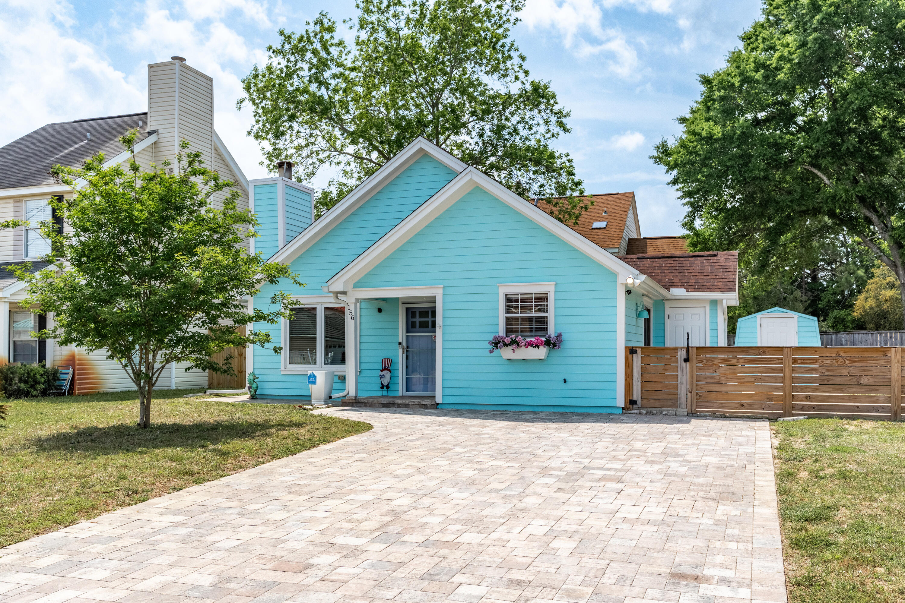 BEACH VIBES ON BEACH DRIVE. This beautifully updated home blends modern updates with a soft, whimsical charm that's hard to resist. The kitchen is a true highlight, featuring shaker-style cabinets, soft-close drawers, built-in organizers, and plenty of storage--all designed with both elegance and everyday living in mind.Luxury vinyl plank flooring flows throughout the home, offering a modern yet cozy feel. Outside, enjoy a low-maintenance lifestyle with a paver driveway and spacious paver patio perfect for relaxing or entertaining. Nestled on a private corner lot at the end of a quiet street, this home combines grace, function, and comfort in all the right ways.