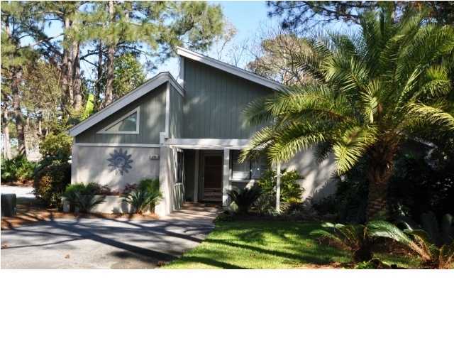This charming two bedroom, two bathroom home is located in a secluded neighborhood near the owner's club pool and the Links golf course. Some of the wonderful features of this home include a wood burning fireplace in the living room, a study with built in cabinets, and a spacious enclosed porch. You will find many updates including new kitchen and baths and laminate and tile flooring throughout. Located on a corner lot this home has an expansive shaded courtyard with pavers and is sure to become a favorite spot for relaxing or entertaining. You will be just a short distance away from the community pool and all of the exceptional amenities that Sandestin has to offer.
