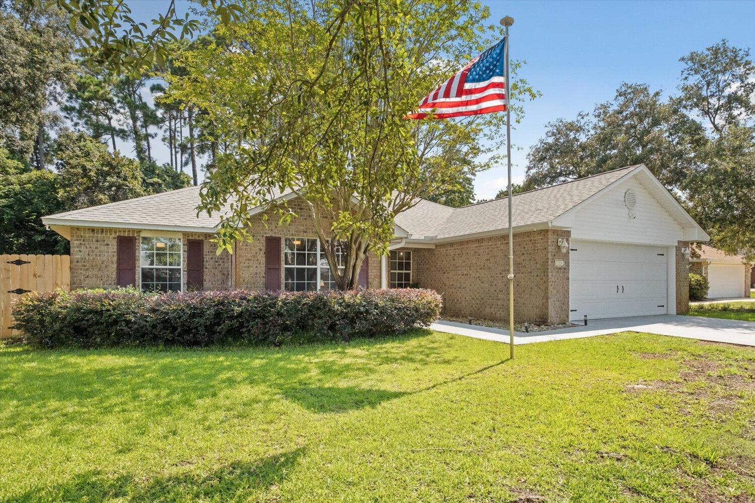 Look no further than this modern, chic home in the sought after waterfront community of Sound Hammock. Upgrades have been made throughout the 4 bedroom, 2 bath gem of a home w/ LVP floors through the entire home, new vanities, kid's garden play set while enjoying the screened in lanai. All 4 rooms in this split plan boast smooth ceilings, new trim, paint and electrical plates, adding to the clean, fresh and airy feeling. The kitchen has been updated w/ high end SAMSUNG bespoke appliances, washer/dryer, granite countertops &fresh new hardware make this a place you'll love to cook and make memories. Along with Roof2021 Overall feel is classic, clean, & bathed w/ natural sunlight. Sound Hammock is a rare find in Navarre w/ sidewalks that lead a HOA maintained pool, nature trail, & deeded sound access w/ new community pier and kayak launch area! Waste no making an appointment to view this unique home.