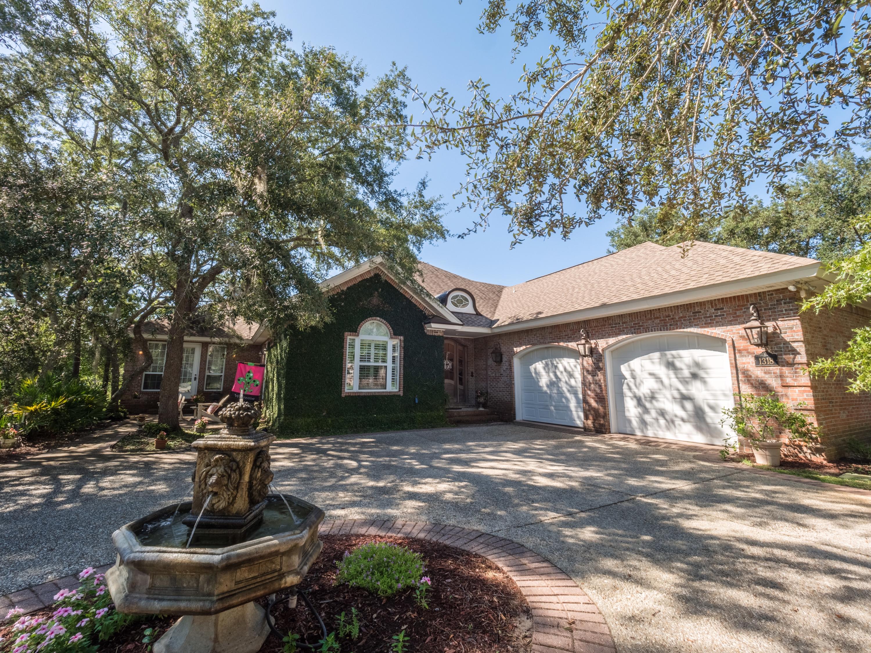Waterfront Home in the gated community of Southwind in Bluewater Bay. This custom built home has 4 bedrooms, 3 down 1 up), and 3 bathrooms, (2 down and 1 up). This home has 3 geothermal HVAC units, extremely low electric usage (see documents). Downstairs are beautiful hardwood floors and wall to wall carpet in bedrooms. Kitchen has custom cabinets and granite tops. Masterbath has walk in shower with steam, soaking tub, and double vanity. Master Closet is HUGE with separate area for shoes. 2 bedrooms downstairs share a Jack and Jill bathroom, lots of closet storage and bedroom #3 has French doors that go out to side patio area. Large den with gas fireplace, study. Upstairs bedroom has screened balcony with views of bay. Bath has ball & claw tub. Home is IMMACULATE.