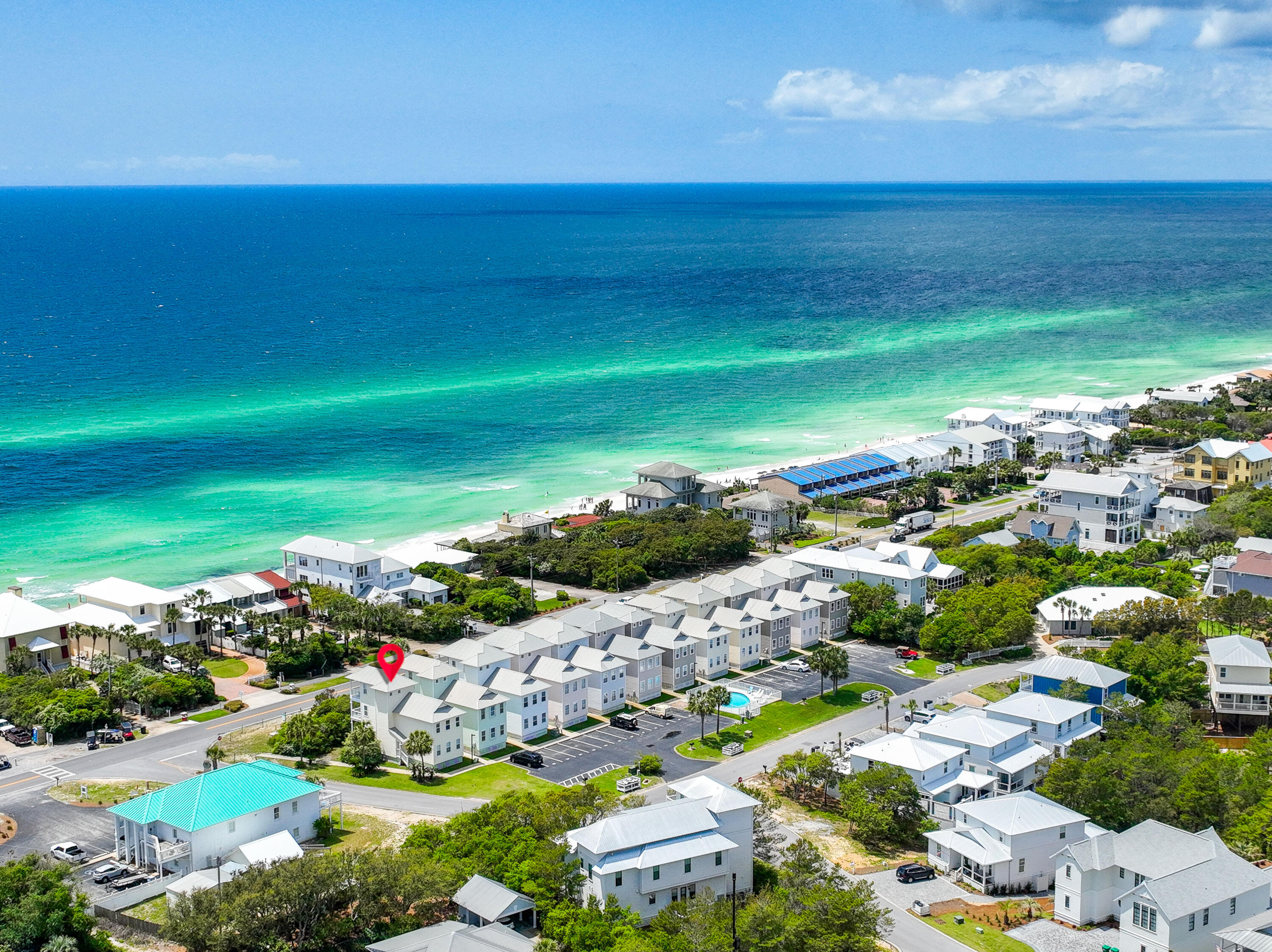 GREAT LOCATION is RIGHT ACROSS FROM PUBLIC BEACH ACCESS!! SO EZ TO GET TO THE BEACH!! GREAT GULF VIEWS from multiple levels of this 4 bedroom, 3.5 bath home right on SCENIC HWY 30-A. This home sits high on a bluff & is close enough to hear the sounds of waves crashing. 25 Seabreeze Trail would make a great 2ND home or VACATION RENTAL. Home has a balcony on each level, 2 BR on first floor, an open floor plan with views & plenty of space to entertain. Kitchen w/ granite counters & stainless steel appliances and an additional bedroom on the second floor. There is another room with 1/2 bath & private balcony on the third floor. With plenty of room and easy access to all 30A has to offer Only 75 steps from the beach access, COMMUNITY POOL dedicated parking spots add to this amazing value!