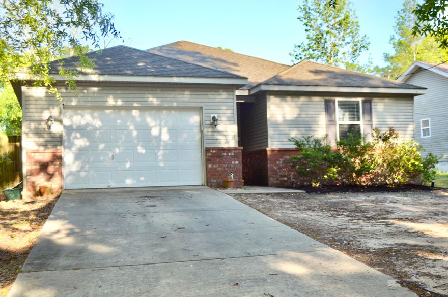 New to the Crestview market! This charming 1,264 sqft residence is nestled in a quiet, friendly neighborhood--ideal for first-time homebuyers or savvy investors seeking a strong rental addition. Inside you will find laminate flooring throughout the main living areas, cozy carpeted bedrooms, and a tastefully renovated master bathroom. The kitchen features repainted cabinets, stainless steel appliances, and a fresh, modern feel. Don't miss the chance to own this move-in ready gem. Schedule your showing today and enjoy everything this beautiful home has to offer!