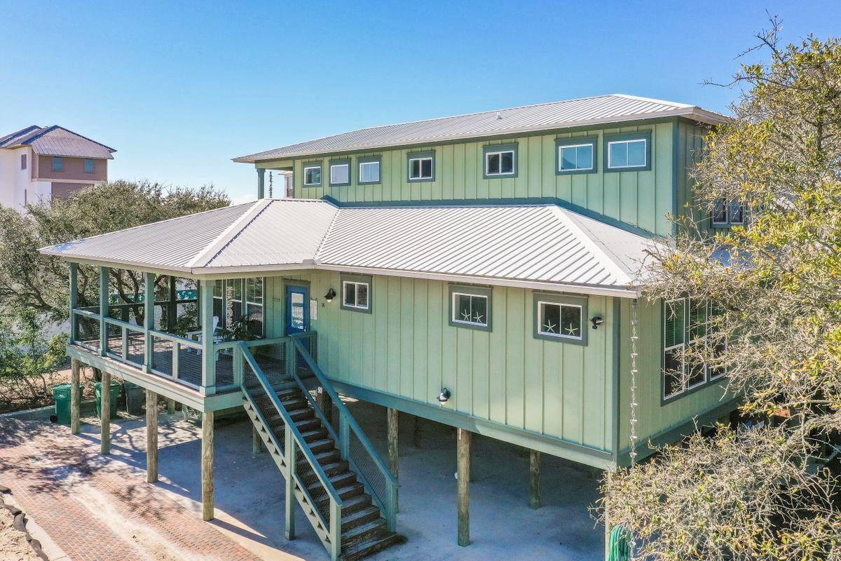 This adorable Florida beach cottage is located south of 30-A east near Alys Beach! Built in 2013, this fully furnished 2,800 sqft custom built home is a hidden jewel in the coveted Seacrest area and is only steps away from the deeded beach access. The beautiful emerald waters and white sandy beach is your back yard and play area! Built on pilings, the first level features an outdoor open covered area for parking and entertaining and has a large walk in shower and large storage area for bicycles, beach chairs, tools etc. The 2nd level features the main living area with open floor plan featuring beautiful hard wood floors, wood nickle gap walls, stainless appliances, walk in pantry, large breakfast island with gas stove and a farm style sink. This main living/kitchen/dining area