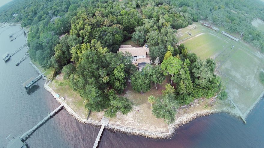 Extraordinary waterfront home located on a quiet cul-de-sac. Unobstructed panoramic views of the Choctawhatchee Bay with 130 feet on the Bay. Enjoy the sunrise and sunset for the rest of your life. As you approach your secluded driveway, the road wraps around to the front of your home. Entering the home, you are greeted with an open, airy floor plan. To your left is the den complete with a fireplace, wet bar, wine cooler, and an entrance to the patio/pool area. To your right is your expansive dining room, living room, and kitchen. Top of the line stainless steel appliances and granite countertops with amble space. Canned lighting with hung lights over the counter. The perfect space for entertaining with the view to match!