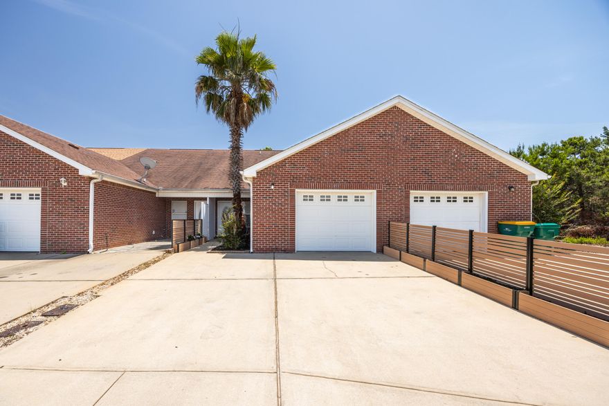This charming Destin townhome is fully repainted and perfect for long-term living or investment! Welcome to your slice of paradise in the heart of Destin. Nestled in the desirable Quail Run community, this beautifully maintained 3-bed, 2-bath townhome is a rare opportunity offering versatility, comfort, and prime location near the pool with a privacy fenced back yard. While short-term rentals are not permitted, this property is ideal as a primary residence, second home, long-term rental, or employee housing.You'll know you've arrived when you spot the towering 20' palm tree out front -- a signature landmark for this standout unit! Inside, the home features a soaring vaulted ceiling in the living room that fills the space with natural light, creating an open and inviting atmosphere. The kitchen and dining area are both spacious and functional, perfect for everyday living or hosting friends and family.

The primary bedroom and full bath are conveniently located downstairs, offering comfort and privacy, while two additional upstairs bedrooms and another full bath overlook a peaceful wooded area ideal for guests, kids, or a home office setup.

One of the property's most coveted features is its rare, fully fenced private backyard, complete with a custom kayak and paddleboard rack a dream for water lovers and outdoor enthusiasts. Located just steps from the community pool, this home also includes a single-car garage and parking space for two full-sized trucks or SUVs.

And let's talk location: You're only minutes from Destin's white-sand beaches, top-rated shopping and dining, Big Kahuna's Water Park, and the vibrant Destin Harbor.

Whether you're looking to live the coastal lifestyle full time or invest in a low-maintenance, high-value property, this Quail Run gem delivers. Just look for the palm tree and welcome home!