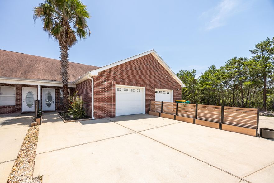 This charming Destin townhome is fully repainted and perfect for long-term living or investment! Welcome to your slice of paradise in the heart of Destin. Nestled in the desirable Quail Run community, this beautifully maintained 3-bed, 2-bath townhome is a rare opportunity offering versatility, comfort, and prime location near the pool with a privacy fenced back yard. While short-term rentals are not permitted, this property is ideal as a primary residence, second home, long-term rental, or employee housing.You'll know you've arrived when you spot the towering 20' palm tree out front -- a signature landmark for this standout unit! Inside, the home features a soaring vaulted ceiling in the living room that fills the space with natural light, creating an open and inviting atmosphere. The kitchen and dining area are both spacious and functional, perfect for everyday living or hosting friends and family.

The primary bedroom and full bath are conveniently located downstairs, offering comfort and privacy, while two additional upstairs bedrooms and another full bath overlook a peaceful wooded area ideal for guests, kids, or a home office setup.

One of the property's most coveted features is its rare, fully fenced private backyard, complete with a custom kayak and paddleboard rack a dream for water lovers and outdoor enthusiasts. Located just steps from the community pool, this home also includes a single-car garage and parking space for two full-sized trucks or SUVs.

And let's talk location: You're only minutes from Destin's white-sand beaches, top-rated shopping and dining, Big Kahuna's Water Park, and the vibrant Destin Harbor.

Whether you're looking to live the coastal lifestyle full time or invest in a low-maintenance, high-value property, this Quail Run gem delivers. Just look for the palm tree and welcome home!
