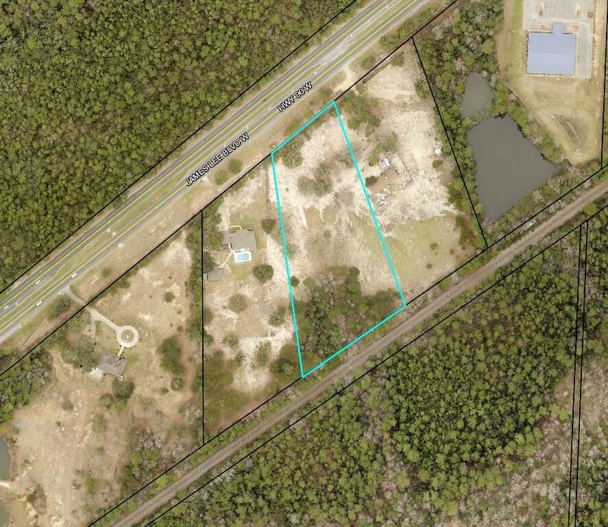 Your Future Dream Home Will Look Amazing on this 4.4-acre partials located on James Lee Blvd (HWY 90) just before the Milligan bridge. Easy commute to all points south and just minutes from HWY 85 & 90. Bring you builder and floor plans and make this beautiful 4.4 acre parcel you new place to call home. Utilities are available at the street.