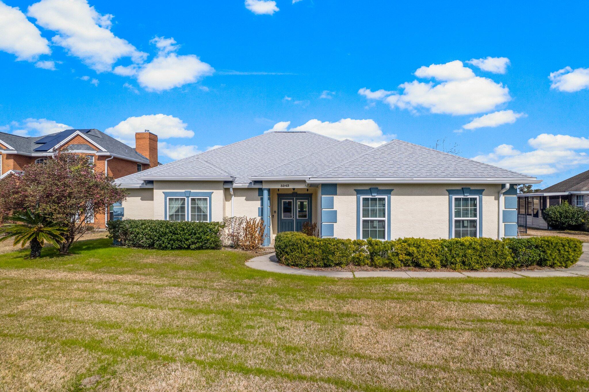 Awesome 4 BEDROOM split-plan home is located on the golf course in one of the nicest subdivisions in the Florida Panhandle. This large lot overlooks the 2nd tee of the course and has a distinct wrought iron fence enclosure. The home welcomes you into a tiled foyer through double entry doors and immediately impresses you with a massive living room and corner fireplace. Looking ahead thru the living room you peer at a spacious family/bonus room overlooking the golf course. To the right is a large modern Island style kitchen with stainless appliances. The passage from the foyer to the kitchen has a half bath powder room and a laundry complete with Whirlpool washer and dryer. To the rear of the massive kitchen is a formal dining room. Click ''more