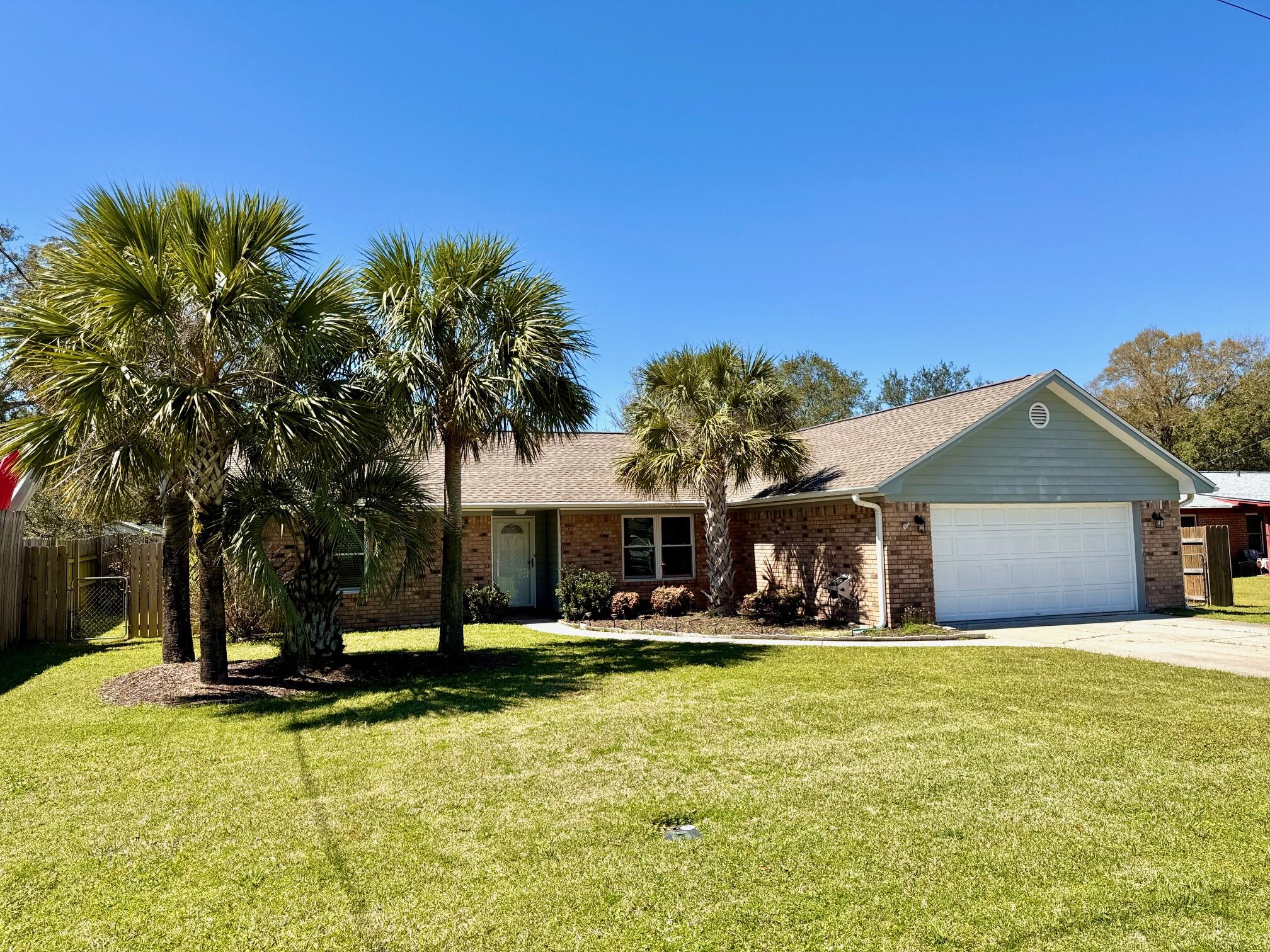 READY FOR YOUR SUMMER! CHARMING POOL HOME IN NAVARRE. THIS QUAINT HOME ON A FRIENDLY QUIET CUL DE SAC INVITES YOU INTO A HAVEN OF FLORIDA STYLE LIVING. The curb appeal starts with a Breezy Palm Tree bed & upon entry you are greeted w/glass block ''eclectic vibe'' foyer half wall and a soaring vaulted ceiling into a spacious LIVING RM w/ample room for multiple furniture configurations. KITCHEN has plenty of solid wood cabinetry, soft close drawers, Corian countertops, SS appliances, pantry closet, eat up bar & breakfast nook. Enjoy a full enclosed SUNROOM loaded with windows, 2 entry doors, separate refrigerator, 2 Fans. A perfect spot for those lazy after swim afternoons. MASTER BR has hardwood bamboo flooring and fan. MASTER BATH has Granite double vanity with his/her drawer spaces & his/her walk-in closets, soaker tub/shower combo. DINING ROOM overlooks the front bed & yard and begs for a long family dining table for those special get togethers. BR #2 & #3 are split from the master BR and share a hall bath with tub/shower combo and an updated single stand alone sink vanity. POOL AREA is visible through the tiled sunroom via the wall of windows and is overlooked by a large 350 sf deck space that is perfect for future pool loungers underneath the shade of a future pergola or umbrellas. The 32x17 VINYL POOL provides a relaxing oasis completed by the Palm Trees, plant beds, gulf-coast breezes and the blue water....Dream Away! Plenty of backyard to enjoy a swing set, a place for pets to roam or to throw a ball around or barbecue outside at the brick grilling wall station - ample size for most grills. The 8' x 12' YARD SHED is in great shape and has power and overhead lighting, a large door (for a rider size mower) and a ramp. Inside is plenty of extra storage.
ADDITIONAL NOTABLES: 2022 Roof. NEW - Exterior garage lights, exterior plug boxes, 2 Stage AC Thermostat & Attic ladder.
Whirlpool SS Appliances. Upper plugs on switches for accent lighting above niches. NO Carpet. 2" Blinds throughout. Irrigation System w/digital box. Extra Samsung Refrigerator. Gutters w/leaf guards. Garage floor coating & insulated door. Convenient Cul De Sac location with friendly neighbors. Near beaches, Bases, restaurants and shopping. This is one to see.