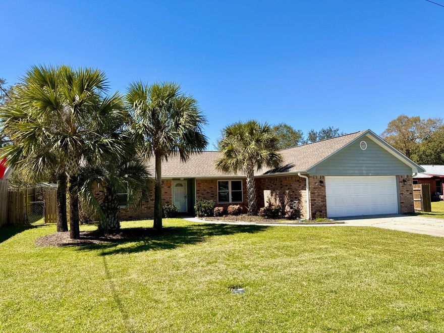 JUST IN TIME FOR SPRING! CHARMING POOL HOME IN NAVARRE. THIS QUAINT HOME ON A FRIENDLY QUIET CUL DE SAC INVITES YOU INTO A HAVEN OF FLORIDA STYLE LIVING. The curb appeal starts with a Breezy Palm Tree bed & upon entry you are greeted w/glass block ''eclectic vibe'' foyer half wall and a soaring vaulted ceiling into a spacious LIVING RM w/ample room for multiple furniture configurations. KITCHEN has plenty of solid wood cabinetry, soft close drawers, Corian countertops, SS appliances, pantry closet, eat up bar & breakfast nook.  Enjoy a full enclosed SUNROOM loaded with windows, 2 entry doors, separate refrigerator, 2 Fans and its own mini split AC system. A perfect spot for those lazy after swim afternoons. MASTER BR has hardwood bamboo flooring and fan. MASTER BATH has Granite double vanity with his/her drawer spaces & his/her walk-in closets, soaker tub/shower combo. DINING ROOM overlooks the front bed & yard and begs for a long family dining table for those special get togethers. BR #2 & #3 are split from the master BR and share a hall bath with tub/shower combo and an updated single stand alone sink vanity. POOL AREA is visible through the tiled sunroom via the wall of windows and is overlooked by a large 350 sf deck space that is perfect for future pool loungers underneath the shade of a future pergola or umbrellas. The 32x17 VINYL POOL provides a relaxing oasis completed by the Palm Trees, plant beds, gulf-coast breezes and the blue water....Dream Away! Plenty of backyard to enjoy a swing set, a place for pets to roam or to throw a ball around or barbecue outside at the brick grilling wall station - ample size for most grills. The 8' x 12' YARD SHED is in great shape and has power and overhead lighting, a large door (for a rider size mower) and a ramp. Inside is plenty of extra storage. 
ADDITIONAL NOTABLES: 2022 Roof. NEW - Exterior garage lights, exterior plug boxes, 2 Stage AC Thermostat & Attic ladder. 
Whirlpool SS Appliances. Upper plugs on switches for accent lighting above niches. NO Carpet. 2" Blinds throughout. Irrigation System w/digital box. Extra Samsung Refrigerator. Gutters w/leaf guards. Garage floor coating & insulated door. Convenient Cul De Sac location with friendly neighbors. Near beaches, Bases, restaurants and shopping. This is one to see.
