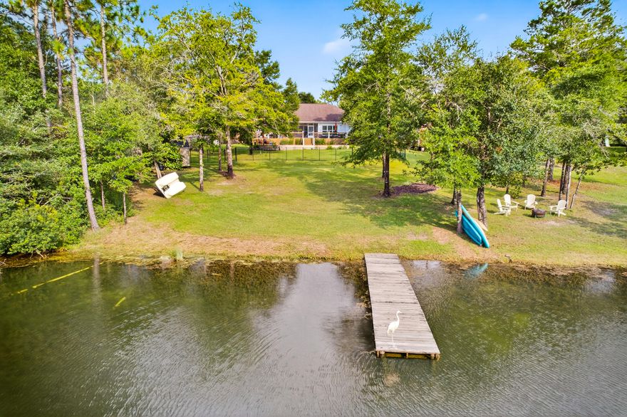 Lakefront Living on 1.20 Acres in NE Crestview!Discover tranquility in this beautifully updated 3BR + office, 2BA lakefront home featuring a heated Gunite pool with PebbleTech finish, private dock, and breathtaking lake views from nearly every room. Inside, enjoy new LVP flooring, plantation shutters, modern paint, and updated fixtures throughout. The spacious kitchen boasts granite countertops, stainless steel appliances (including a double oven stove!), breakfast bar, and a lakeview dining nook. The primary suite offers French doors to the back deck, dual walk-in closets, and a remodeled spa bath with a standalone tub, walk-in shower, dual vanities, and private water closet. Guest bedrooms feature new carpet and share an updated full bath. Multi-mood lights in the ceiling accent the Seller is including a new roof (2026)! 
Additional highlights include:
Shiplap feature wall with electric fireplace
Covered patio, long-lasting composite deck, and amazing cable railing for perfect pool and water views!
Custom shed, and expanded boat/RV parking pad
Zoysia sod, rock-lined flower beds & lake-fed sprinkler system
New Bosch HVAC, surge protector, cleaned air ducts
Built-ins & spacious laundry room
This home blends comfort, style, and peaceful waterfront livingjust minutes from town. Seller may include select furnishings with an acceptable offer! The master bathroom chandelier will be replaced.
2 Full Baths and a 1/2 bath, Perfect for guests and family living.