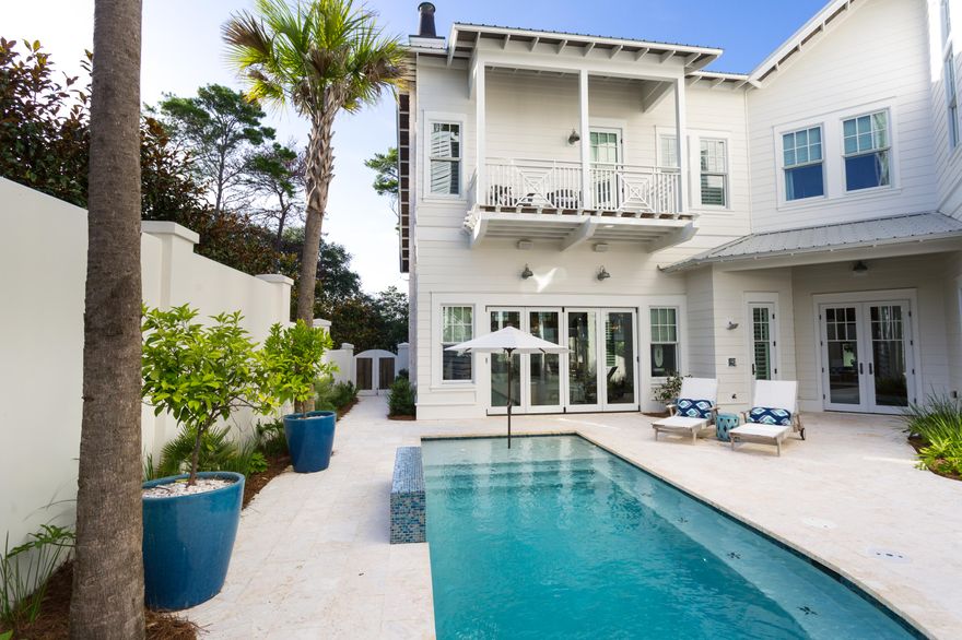 A true sanctuary in a highly coveted location in Old Seagrove, this 5BR/6.5BA Gulf view retreat was custom-built by Alex Rice of Old Seagrove Homes. Private courtyard walls surrounding an outdoor oasis with a gunite saltwater pool, a fire pit and a grilling and dining area creates a peaceful, secluded ambiance yet the beach, Seaside and WaterColor are just steps away. Every detail of this home has been meticulously selected and the quality of materials is evident from the moment you enter the gorgeous Mahogany front door. A chic coastal style creates a bright and sunny vibe where pecky cypress accents contrast with white walls and carefully chosen design features such as a grand tabby shell fireplace in the living room.