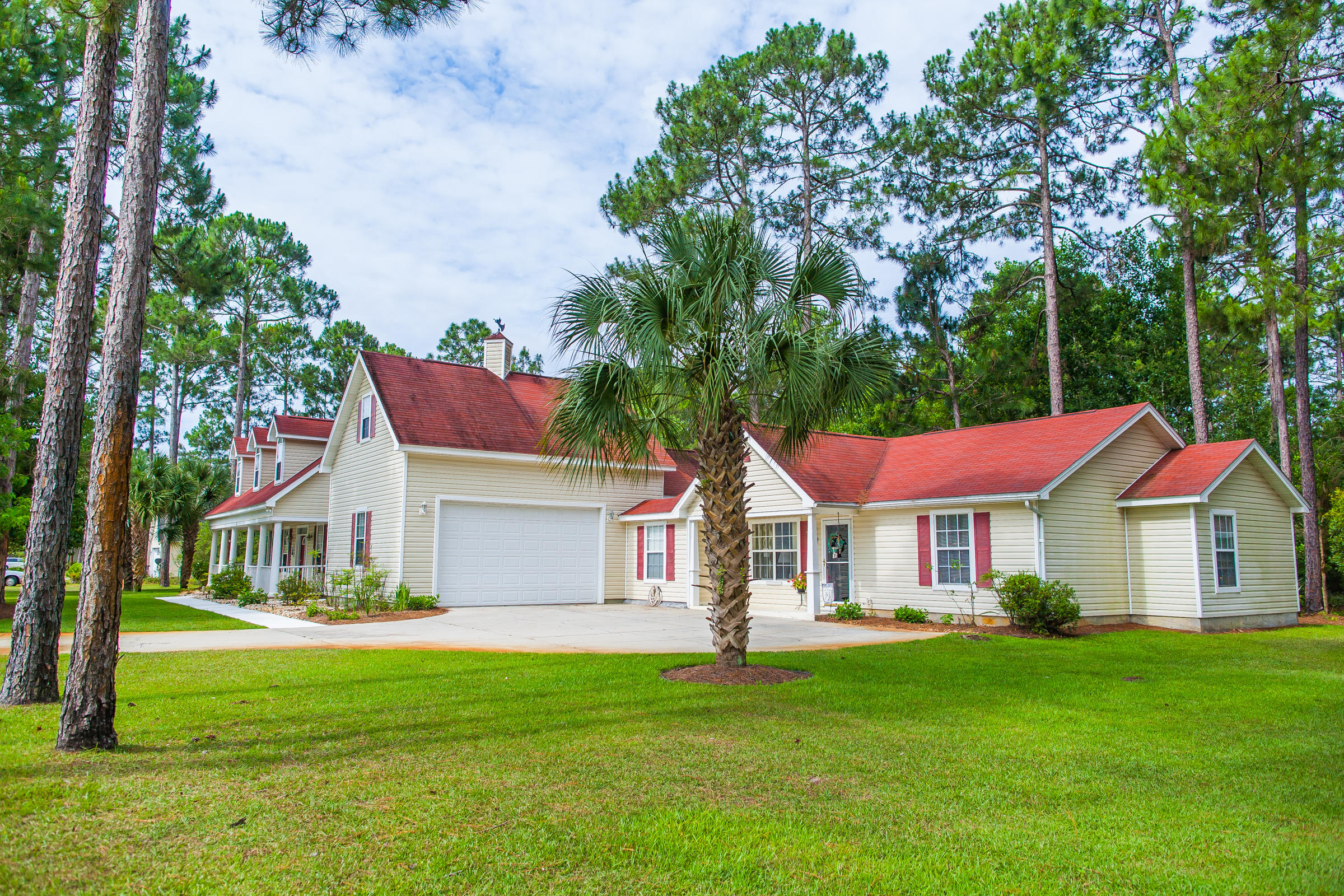 Live on over one acre in a sophisticated four bedroom planter's cottage with a two bedroom guest house, approx 1000 sq ft, reminiscent of a time-honored style of the South. This beautiful Southern Living HomesPlaces home by William E. Poole Designs sits on a lovely acre lot. The home is accented by shuttered windows and features a full width front porch with six Doric columns. Three dormer windows punctuate the steeply pitched red gabled roof of the main house. The carriage style garage wing connects the roomy guest house. You will love living on a quaint street away from crowds yet minutes away from the coastal towns of 30A, white sandy beaches of the Gulf of Mexico and the finest shopping and dining on the Emerald Coast. The owners describe the neighborhood as peaceful and quiet a the home offelifestyle perfect for entertaining family and friends. The spacious screened lania is large enough for outdoor living and lets on to sparkling, enclosed swimming pool. The home truly has a room for every purpose from formal and casual entertaining to places for offices, hobbies and flex space. Solid oaks floors are in the dining and living room. Interior appointments include central vac system, ample storage and a gas fireplace. Home features a whole house generator that runs on propane gas as well as a sprinkler system for maintaining your beautiful lawn and an outdoor storage shed for all of your lawn and gardening tools. The guest house is spacious and ideal for a year round resident if desired. All appliances are included in both the main home and the guest house. Currently a tenant is on a month to month in guest house. Hamon Haven is bordered by acres of State Forestry and a church. We invite you to make an appointment today to preview this beautiful Southern style home and learn more about living on Hamon Avenue in South Walton.