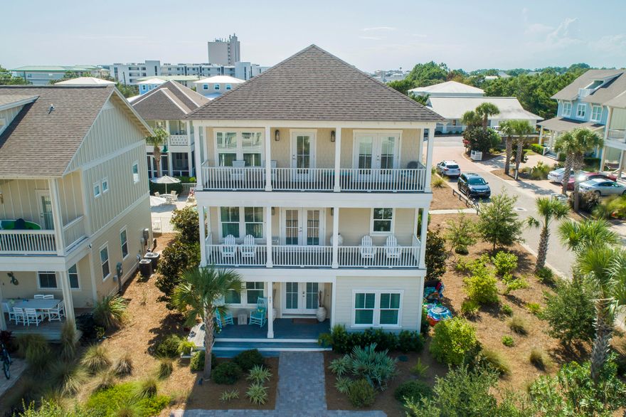 This Magnolia Dune home is perfect for every buyer. It's located in the heart of Seagrove Beach just a short walk to multiple beach accesses. The Scenic Hwy 30A bike path is just a couple of homes over and is perfect for a quick bike ride to Seaside, Watercolor, etc. The open floor plan makes for easy living and the furnishings are impeccable. Beautiful hardwood flooring is featured throughout the home with tile in all bathrooms. Built in 2015 and coming with all of the upgrades like a gas tankless water heater, gas range in the kitchen, stainless steel appliances, white cabinetry, etc. The bedroom and full bath on the 1st floor make it easy to accommodate all guests. The 3rd floor features an additional living area along with the ideal spot to entertain on the oversized viewing porch with outdoor kitchen.  Enjoy sunsets and gulf views from this western facing porch.  Walk right out the back door to a gas grill just steps to the neighborhood pool.  Call today to view this beautiful property.  All information is deemed to be accurate, but should be verified by buyer.