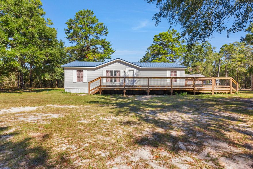 Country Living minutes away from the Beaches and Freeport!Discover this beautifully updated home situated on 5 acres of partially cleared land, offering privacy, space, and endless potential. The property features a brand new deck overlooking a large above-ground pool, perfect for enjoying Florida's outdoor lifestyle.Recent upgrades include an abundance of interior renovations, ensuring move-in readiness and peace of mind. The land offers both open and wooded areas--ideal for recreation, gardening, or future expansion.Conveniently located near the rapidly growing town of Freeport and just a short drive to the Emerald Coast's beautiful beaches, this property combines the best of country living with easy access to shopping, dining, and coastal amenities