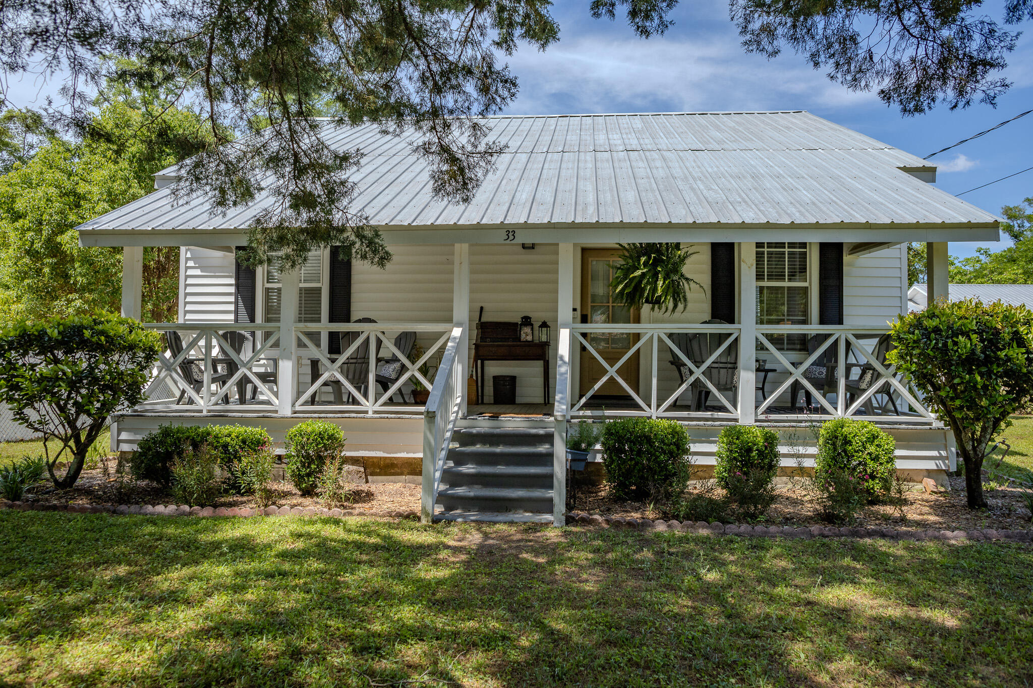 Charming Historic Cottage in DeFuniak Springs - Close to 30A Beaches!Welcome to an adorable 2-bedroom, 1-bath historic cottage nestled in the heart of charming DeFuniak Springs. This well maintained home features a classic metal roof, inviting front porch with cross-rail detail, on a quiet street. New flooring, new appliances, new tile bath surround and fixtures.Step inside to find a cozy, thoughtfully laid-out interior filled with natural light and vintage charm. Whether you're looking for a weekend retreat, full-time residence, or an Airbnb investment, this cottage checks every box.Located 3 blocks from Lake DeFuniak and walking distance to the shops/dining of downtown, less than 30 minutes to the white-sand beaches of iconic 30A, small-town living with coastal perks!