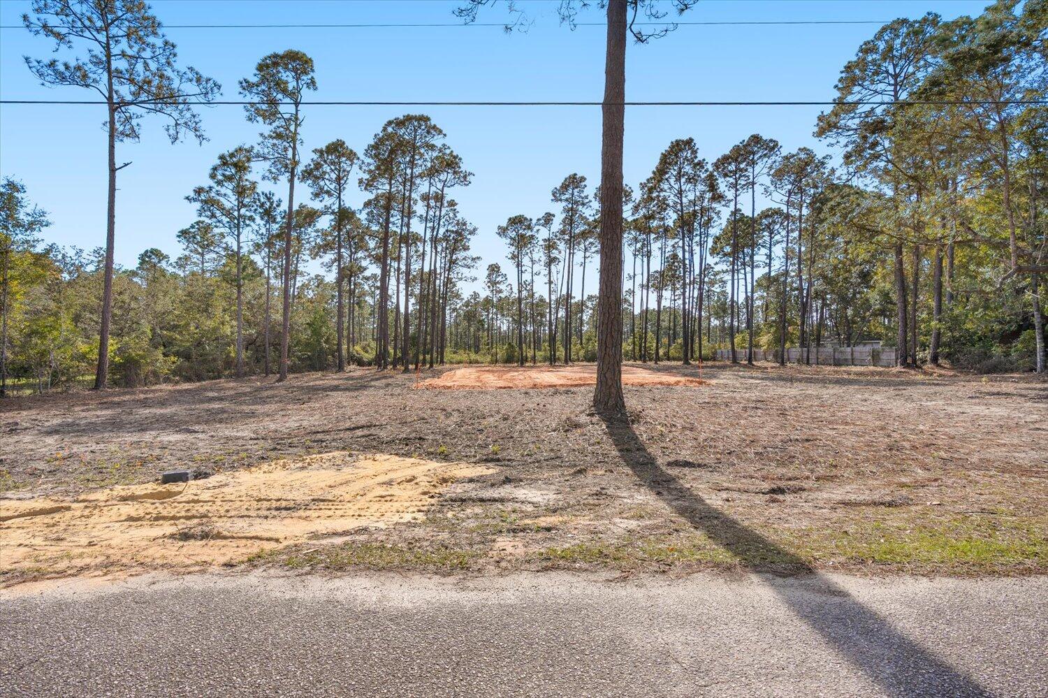 Looking for a fantastic place to build your dream home? This lot could be it!!! Ideal location so you can be in Pensacola, Pace, Gulf Breeze or at the beach quickly!. The lot has been cleared ready for you to get started! Stumps removed and lot was root raked. 8 Trucks of fill dirt have already been placed on the lot. Wetlands study has been completed and is available for you. There is a tiny amount of wetlands in one back corner. Survey is also available. The water tap has been paid and water meter is at the property. Perk test has been done for a 3 bedroom house and benchmark is already on lot for septic placement. Call your favorite agent today to get more info on this great opportunity!