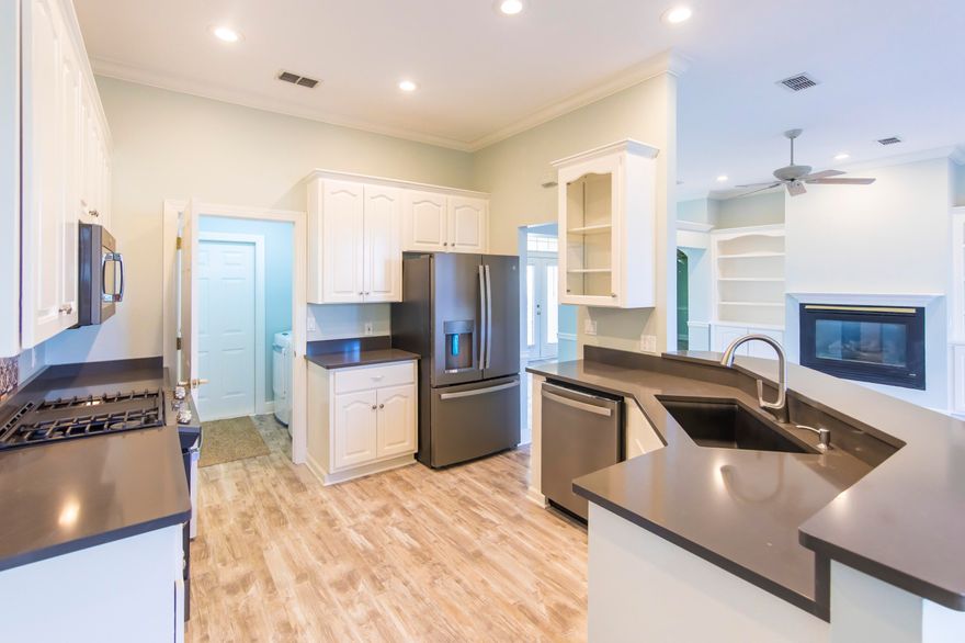 Beautiful move in ready renovated home in Summer Breeze. This home features new flooring, new kitchen - all appliances new, and new windows. New washer/dryer convey with the home. All on one level this 3 bedroom 2 bath home has a separate dining AND bonus room used as an office. Original screened porch was enclosed so actual heated/cooled square footage is greater than property appraiser and listing show. Very large master bedroom and bathroom along with two car garage. Just a short walk to the beach! Do not miss out on this opportunity to own in Summer Breeze.