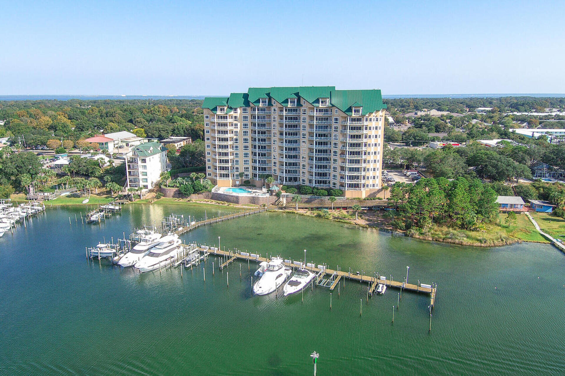 Enjoy Stunning Gulf and Harbor Views from this Amazing and Recently Renovated Condo. Look to the South and you will see the Harbor, Holiday Isle, and the beautiful turquoise waters of the Gulf of Mexico. To the West, sensational sunsets, luxury yachts and fishing boats can be seen coming in and out of the Harbor. There is a super sized 70' x 22' Boat Slip that can be purchased separately. Experience luxury living in this beautiful 4 bedroom condo at Grand Harbor. This fabulous condo is sold completely furnished and move in ready. Singular attention was paid to every detail including the state of the art, whole home, audio/video system that was installed at a cost of more than $40,000.
