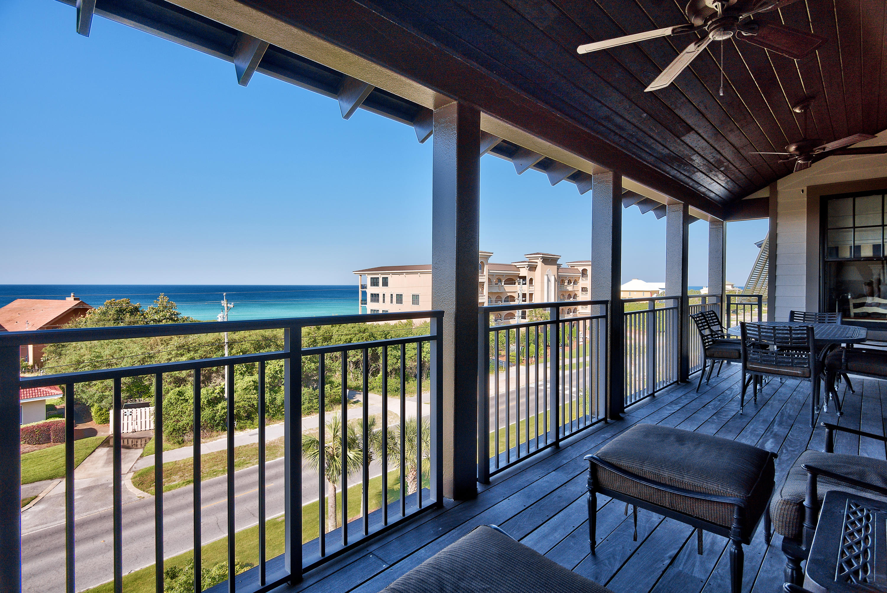 LOCATION is everything! Top floor unit with views of the Gulf from the oversized private balcony with space for dining and entertaining. Deeded Beach access is just across 30A. Condo features kitchen/living room flooded in natural light, Spacious kitchen with Stainless appliances,range hood,recessed lighting,granite countertops and breakfast bar overlooking the living/dining room. Crown molding,ceiling fans,and heating/AC throughout,carpet in bedrooms,tile in baths, and hardwoods in kitchen/living. The Master has balcony access, large bathroom with separate bath, shower and granite counter top double vanity. 2 bedrooms both with plenty of natural light, 1 with full en-suite shower and granite top vanity. Rooftop pool and hot tub has views of the gulf, owner's lounge and fully equipt gym.