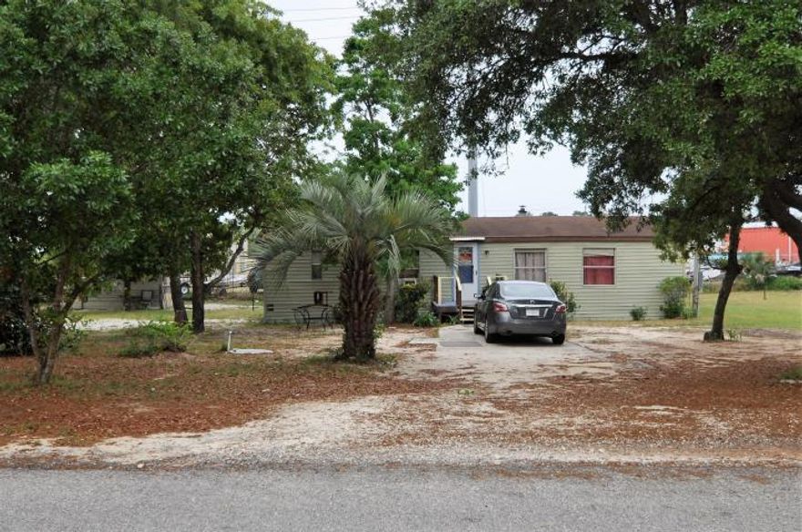 Perfectly priced 3 bedroom home on a huge 1/2ac lot on the west end of the beach. Do you want to live in paradise for under $100,000. This would even make a great lot to build your exquisite custom built beach home. You are minutes to stunning 30A' Ride your golf cart to the beach... eat at distinguished and award winning restaurants..tons of shopping...and the most beautiful beaches in the world..or make your own peaceful country home.. you could do so much with this property..great yard for bbqing...