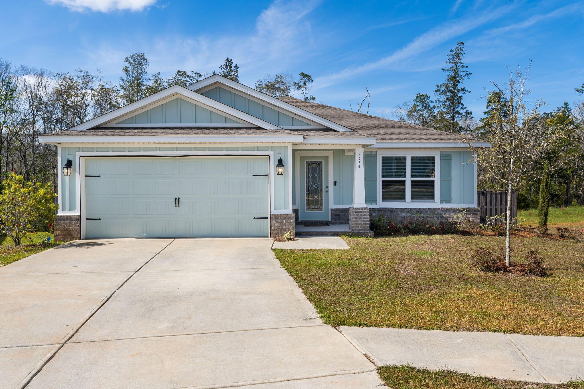 Welcome to 594 Marquis Way in Freeport, FL! This beautiful 3 bedroom, 2 bath home is situated on the second largest lot in the neighborhood and offers a private, wooded backyard view. The home also includes an additional flex space room for an office or den. Enjoy 1859 sqft of spacious, open concept living with vaulted ceilings, Quartz countertops, stainless steel appliances, and LVP Flooring. Brand new carpet in all bedrooms and a first floor primary suite make this home a must-see. The fenced back yard and screened in patio are perfect for entertaining or just relaxing and taking in the view. Don't miss out on this amazing opportunity to live in a gated community.
