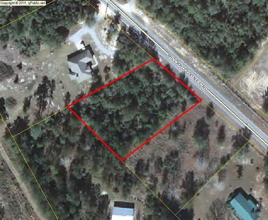 Beautiful building lot on paved road near I-10 exchange. Only 30 minutes to the beaches. Lot is wooded; the lot to the south of this one is available also for $15K.