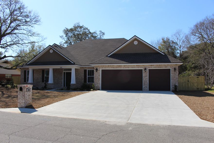 Large 100 ft wide lot with beautiful oaks, 5 BR, 3.5 BA, two story brick home, 3 car garage. Spacious open family room, formal DR, kitchen with a breakfast nook, cabinet handle upgrade, ceilings 10.1 in living areas and 9.1 in BRs, casement window trim, window & door blinds. Master bedroom has his and hers walk-in closets, master bath with his/hers vanities, walk-in shower,garden tub,2 HWH (one gas tankless), gas for BBQ grill. Covered front entry porch, covered back lanai patio, 18 SEER/4 Zones HVAC, added extra electrical outlets. Kitchen upgraded granite counter tops & backsplash, stainless steel upgraded appliances, upgraded kitchen & bathroom cabinets, large walk-in pantry, increased shelving in home. Upgraded lighting & flooring: wood type tile in livings areas, tile in baths,