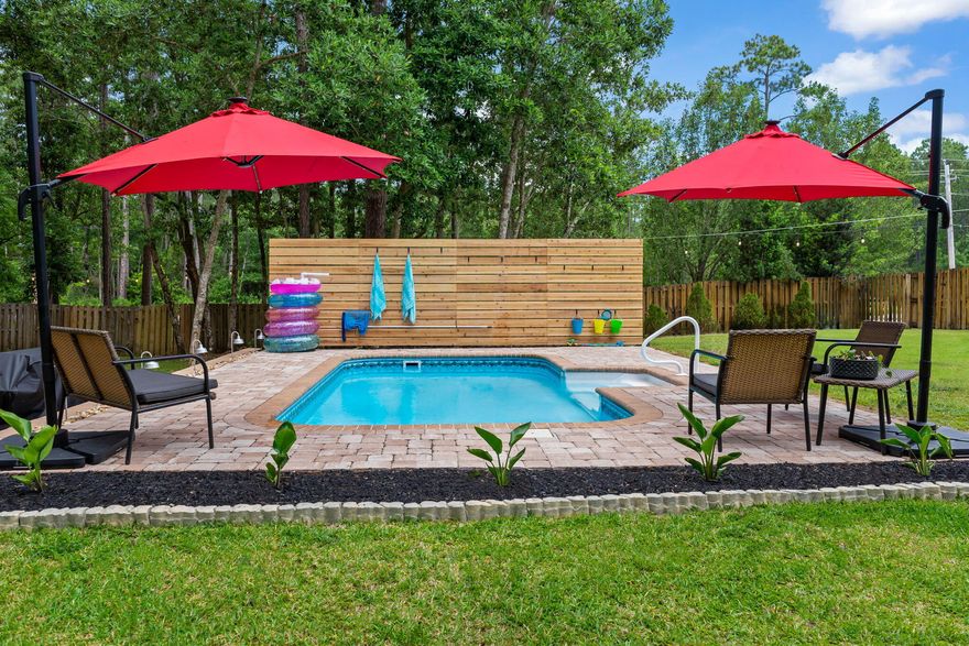 IMMACULATE 4B 2.5BA Updated brick home nestled on .55 acre corner lot with fenced in backyard, swimming pool, exterior shed, whole house generator, New 2023 HVAC, fresh paint throughout, upgraded lighting and plumbing fixtures and MORE! The spacious kitchen has New granite countertops,  lots of cabinet space, 2 pantries, island and built in desk. Cathedral ceiling in living room is perfect for entertaining family and friends, there is a 2 car garage and plenty of parking. Master bedroom has private entrance to your outside oasis with mature trees as the back drop.You will feel like you are living in the country just minutes to Navarre beach, shopping and local restaurants. Holly by the Sea owners enjoy access to the boat launch, dock, community activities and recreation. Perfect SERENITY!